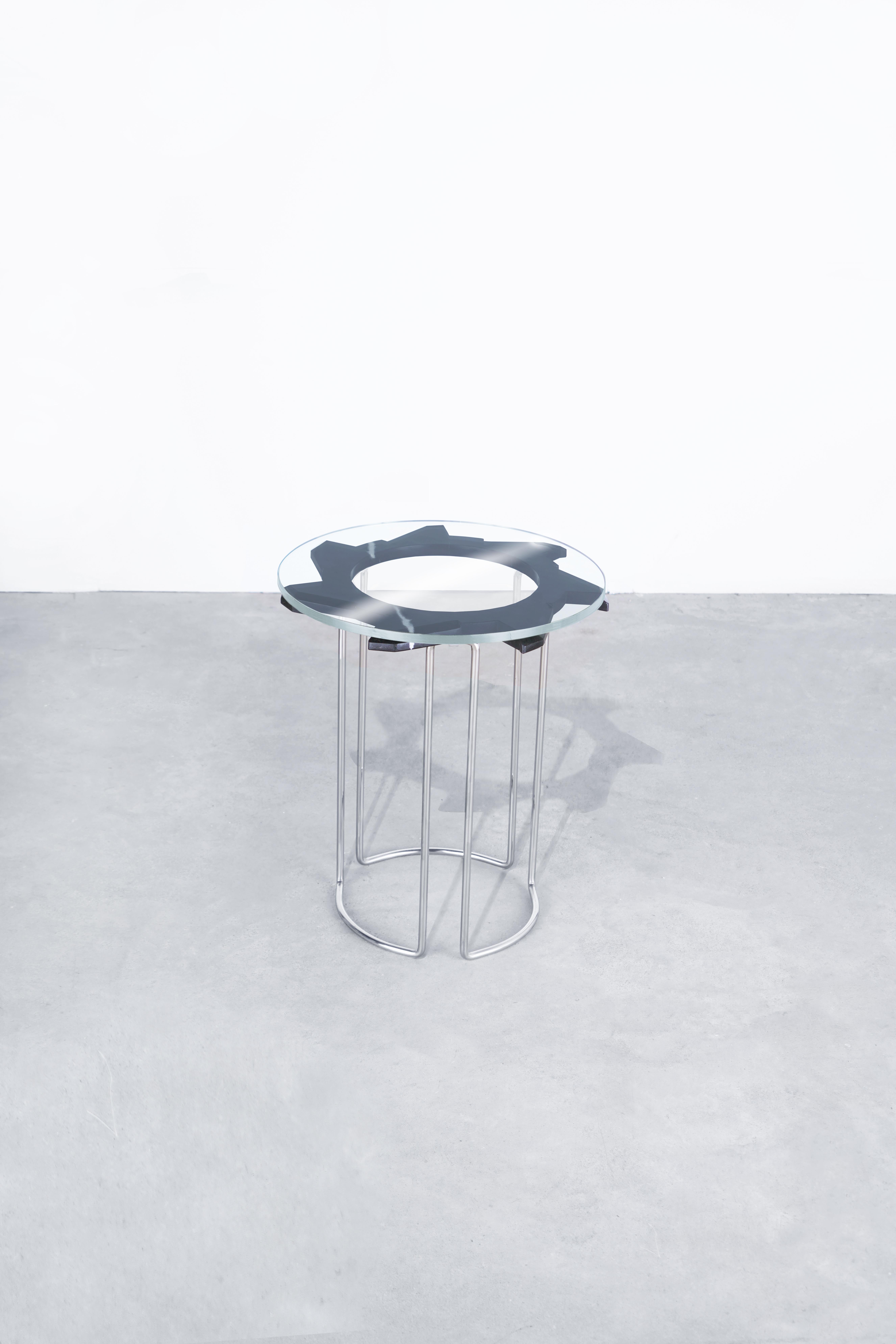 Description
Water jet cut, hand-beveled + hand-polished nero marquina marbletable, with tempered glass top. 
Hand-formed + hand-polished stainless steel legs, welded into one continuous table base. 
Starphire glass top. 
Position alone, or nest