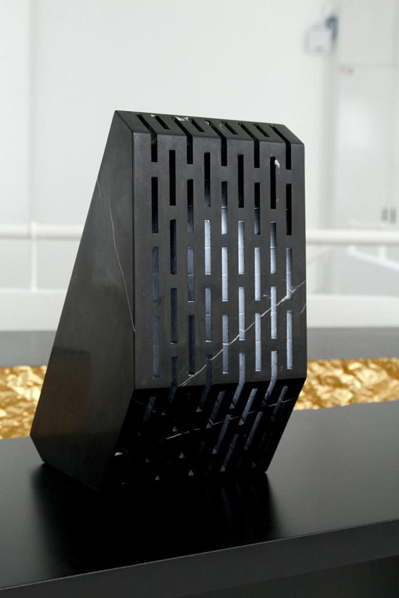 A secret light comes from the hexagonal cells of this limited edition wall lamp created in black Carrara marble. A bright crystal produced in 3D printing polymer is hidden inside the lamp. Two extremes are connected with exactitude: on one side the