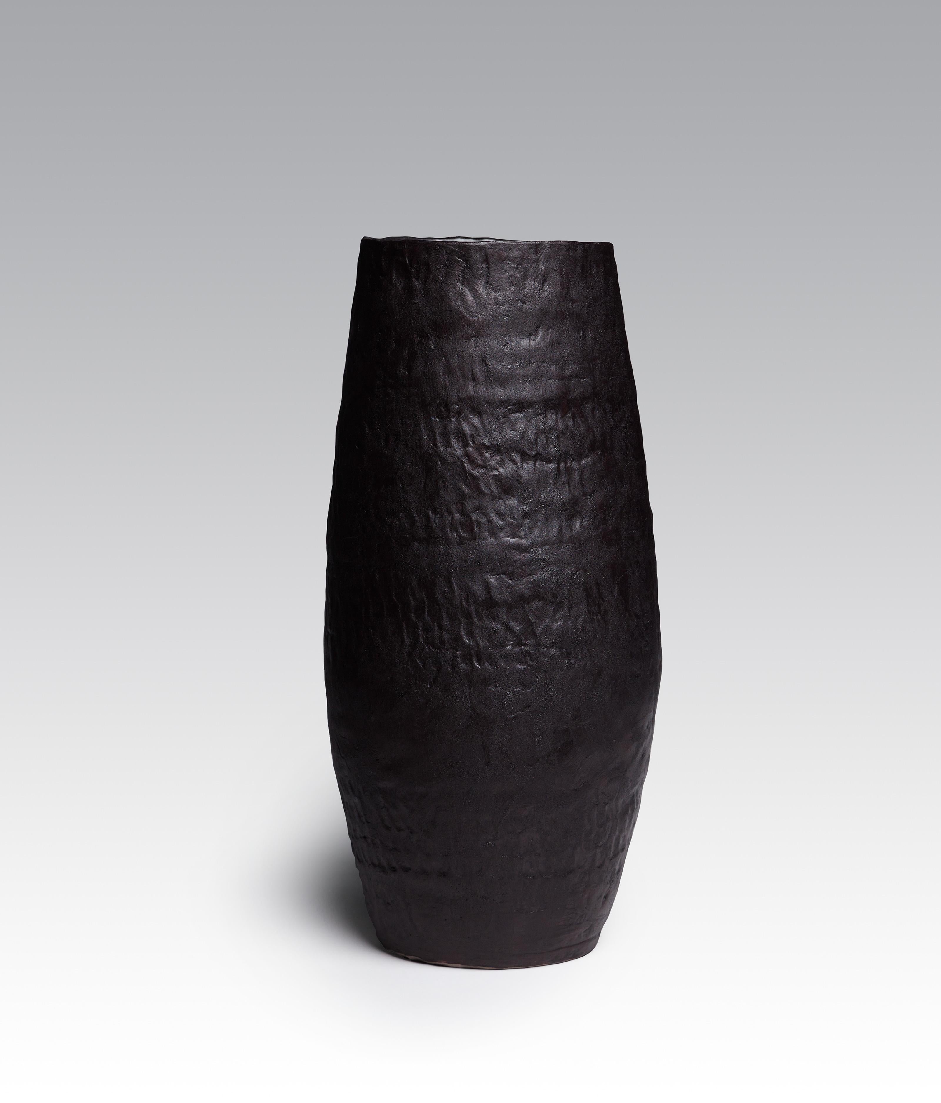 Traces of the hand are prominent on this series of large-scale stoneware vases. Handcrafted by pinching and coiling, each one is then glazed by pouring. 
The collection consists entirely of unique pieces.

Used for indoor purposes. 

