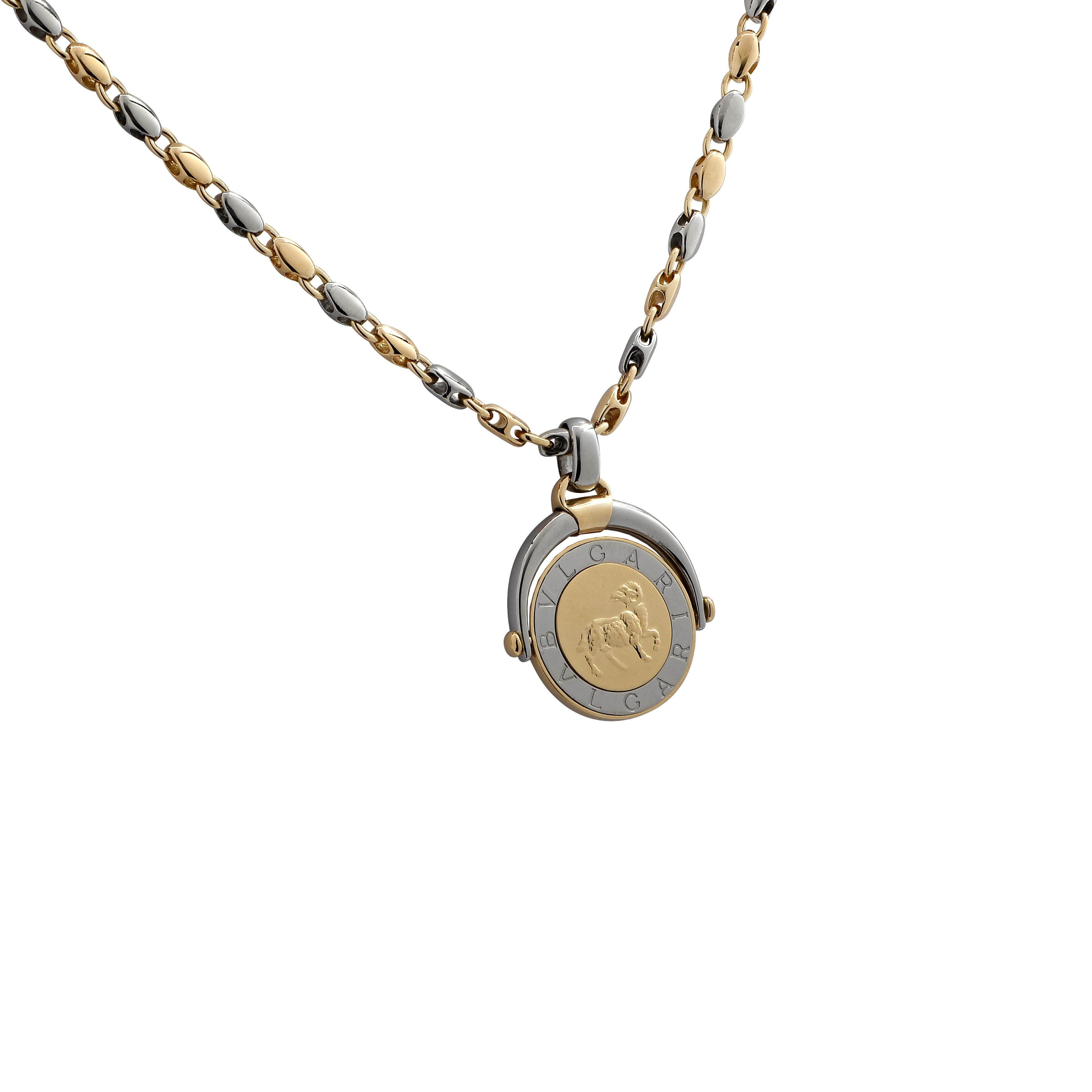 Stunning Bvlgari necklace crafted in 18 karat yellow and white gold. Yellow gold and white gold links alternate to form a chain measuring 34 inches in length and 3.8 mm in width. A zodiac Aries medallion pendant crafted in yellow and white gold and