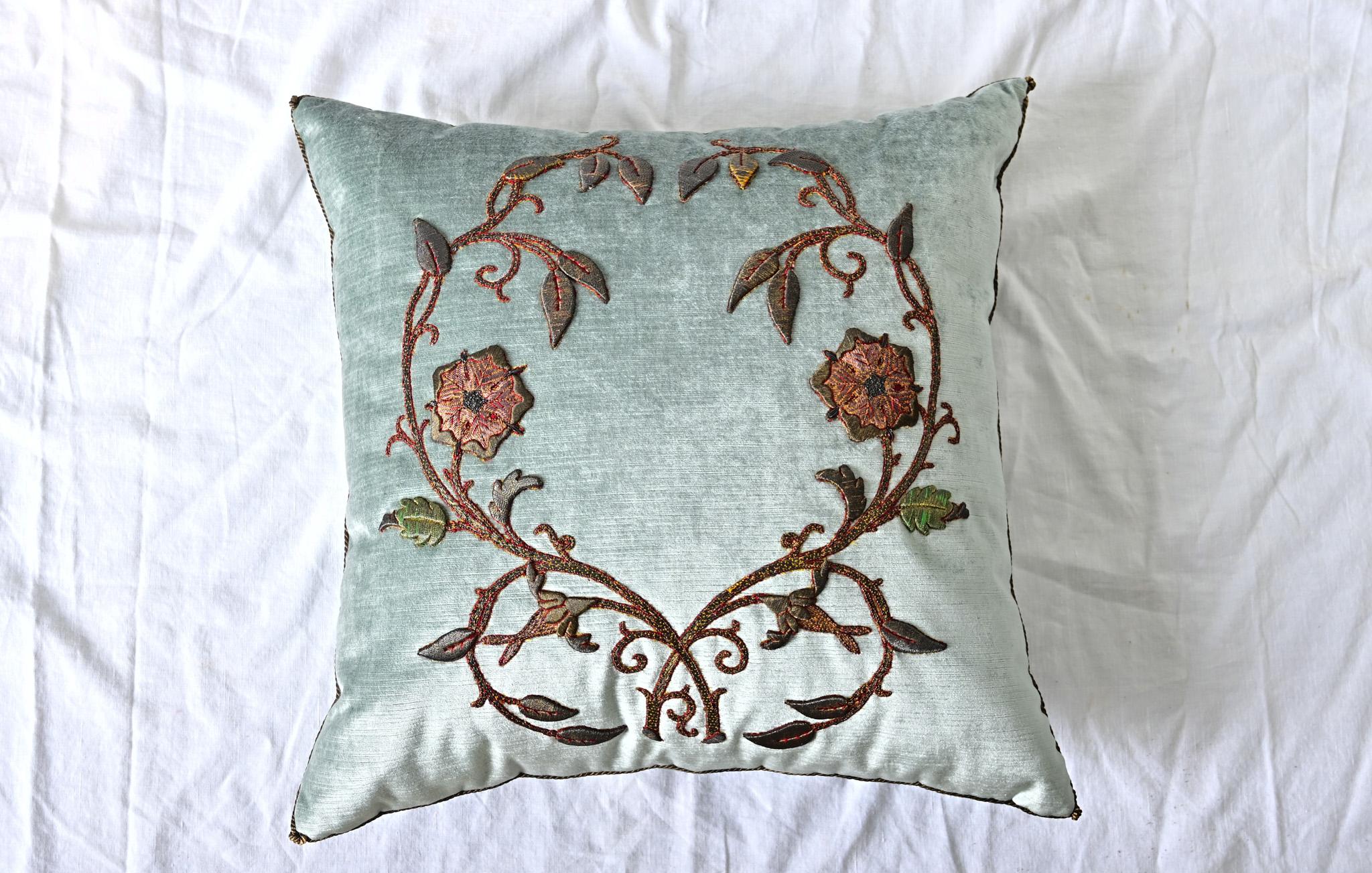 Recently made toss pillow using antique European embroidery (most likely from 18th century France) of golden bronze raised metallic and colorful threads depicting vining flowers on pale blue “Cape” velvet.  Hand trimmed with vintage gold metallic