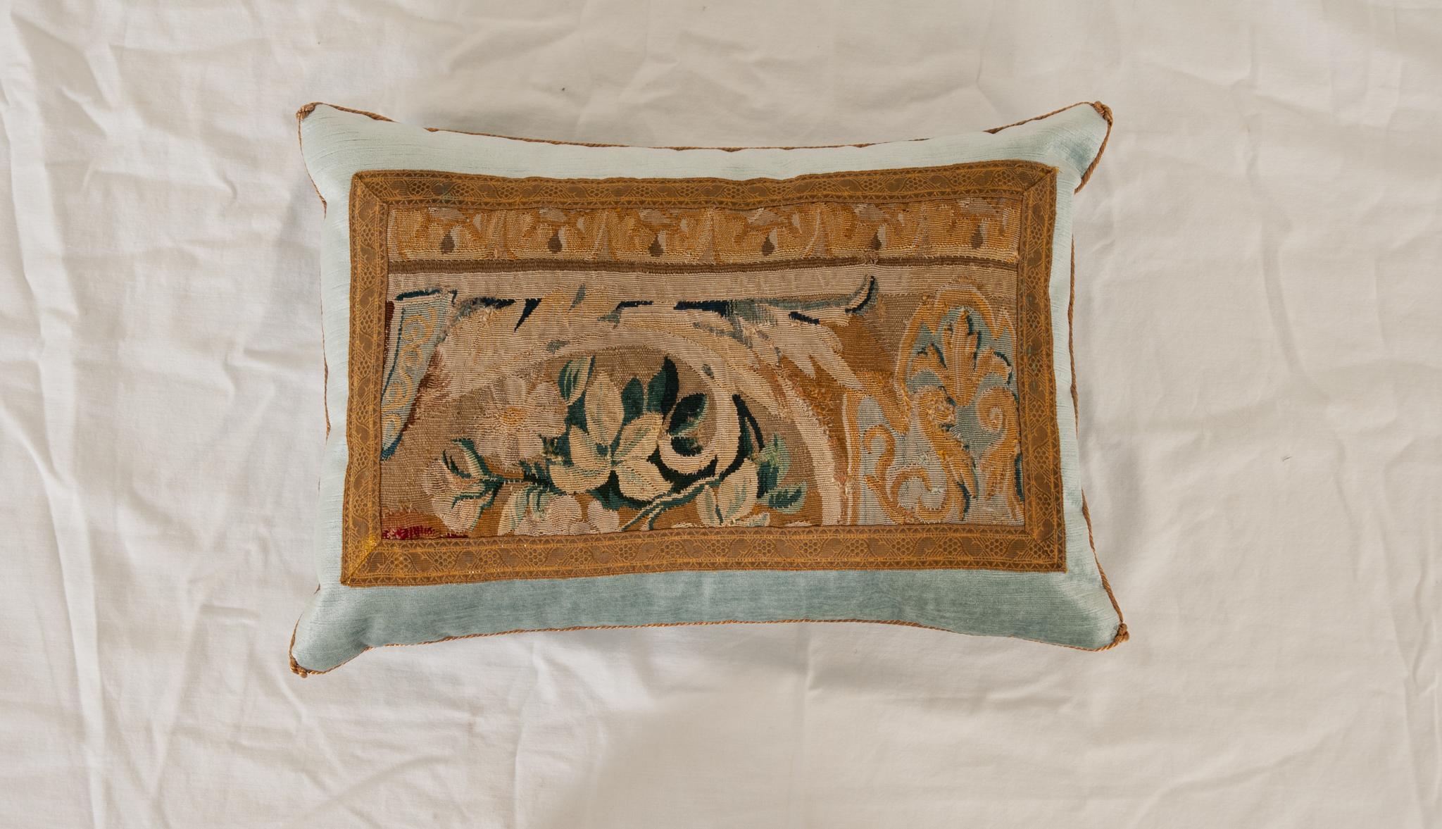 Antique 18th Century tapestry fragment, bordered with antique gold metallic galon on sky blue velvet. Hand trimmed and knotted in the corners.
