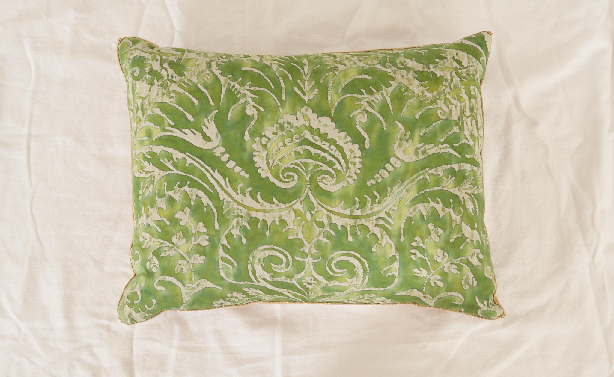 Antique European pillow in green and white, backed with champagne velvet. Hand trimmed with vintage gold metallic galon, knotted in the corners.