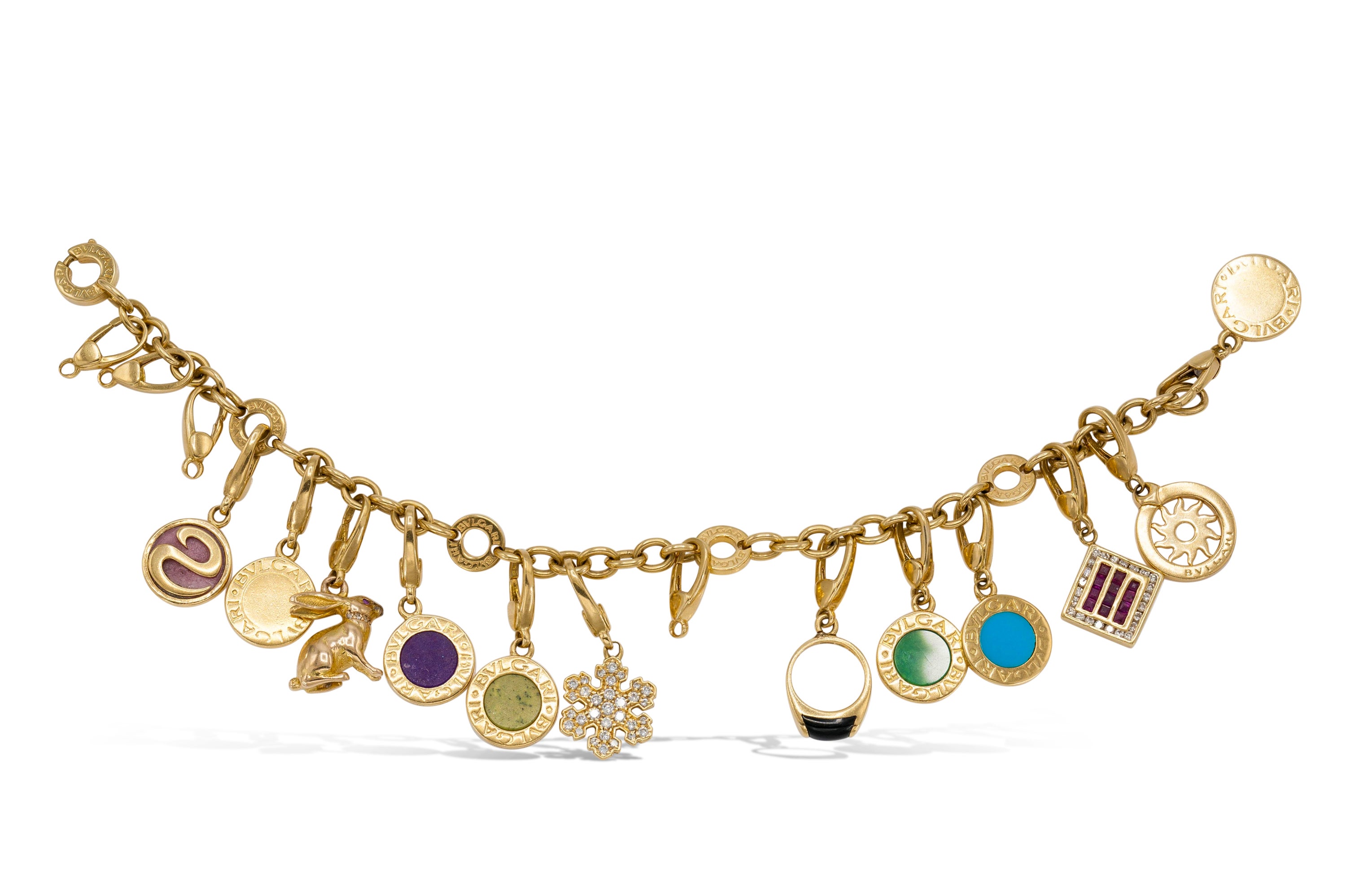 Finely crafted in 18K yellow gold with 12 original Bvlgari charms featuring various precious and semi-precious stones.
Signed by Bvlgari.
Size 7 inches.