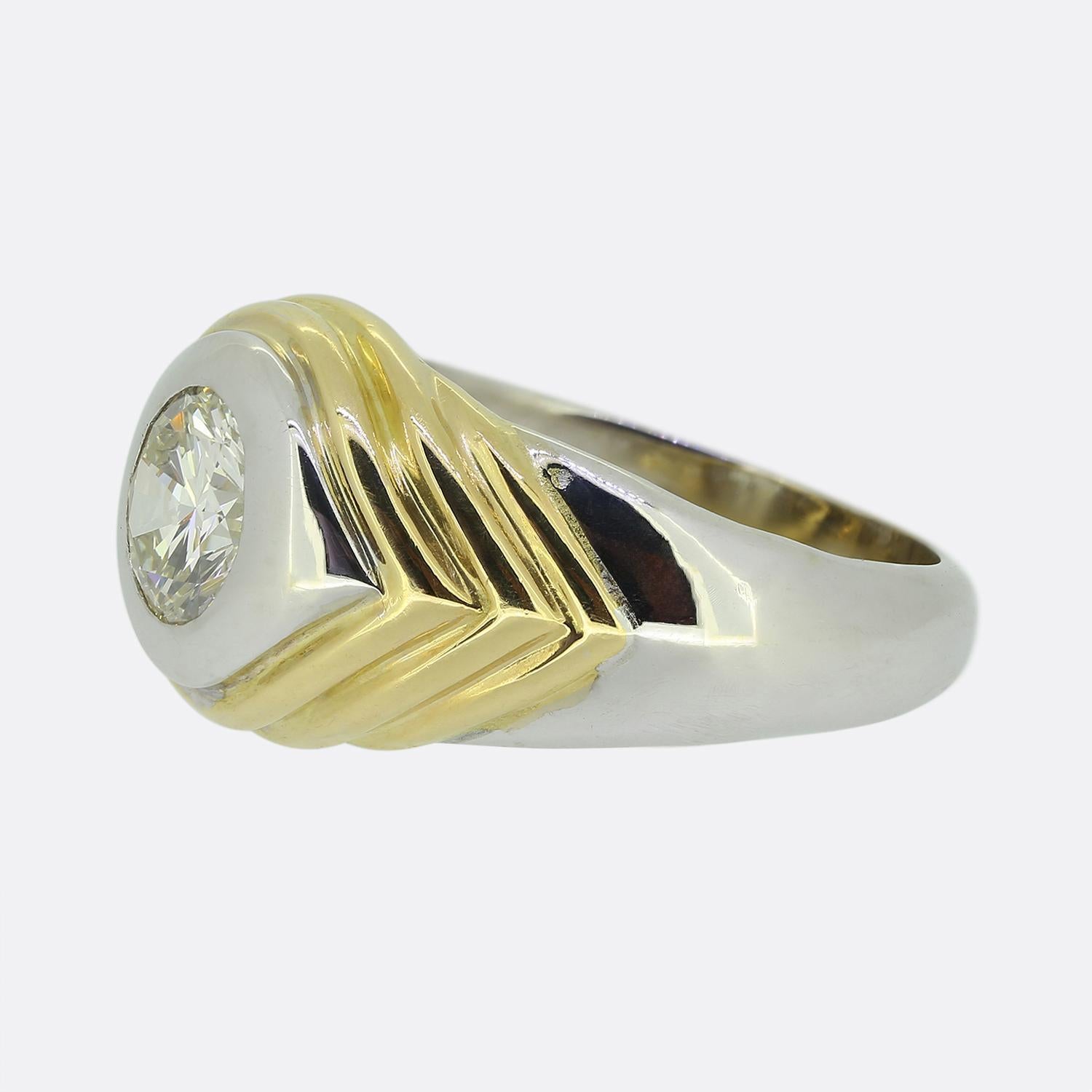 Here we have an outstanding diamond ring from the world renowned Italian jewellery house of Bvlgari. This vintage piece has been crafted from 18ct white gold whilst showcasing rich yellow gold stepped shoulders leading to an impressive 1.28ct round