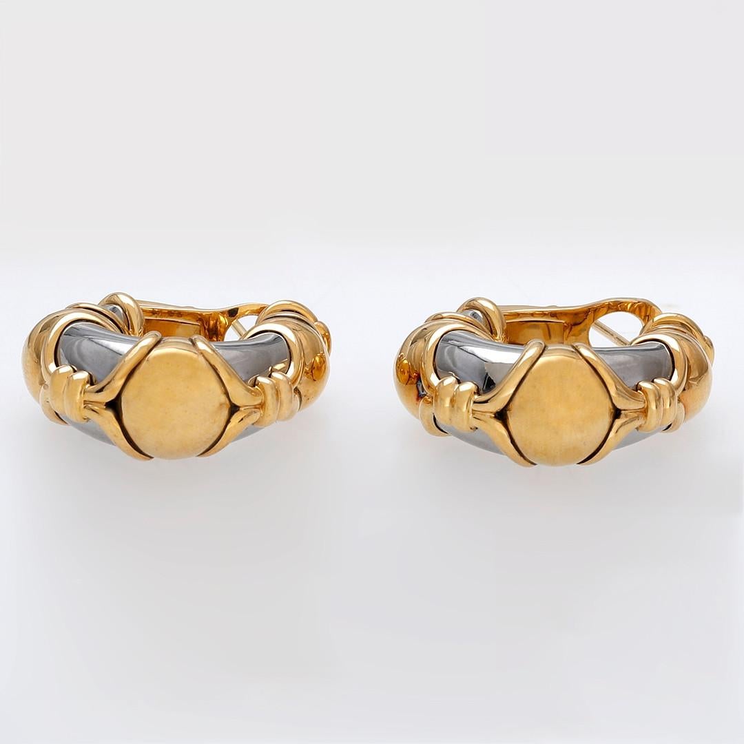A powerful design that is as effortlessly cool as it is purposely elegant.

Italian Hoop earrings with a powerful attitude - 18 Karat gold and stainless steel. A display of craftsmanship as steel is notoriously hard to work with and takes a lot