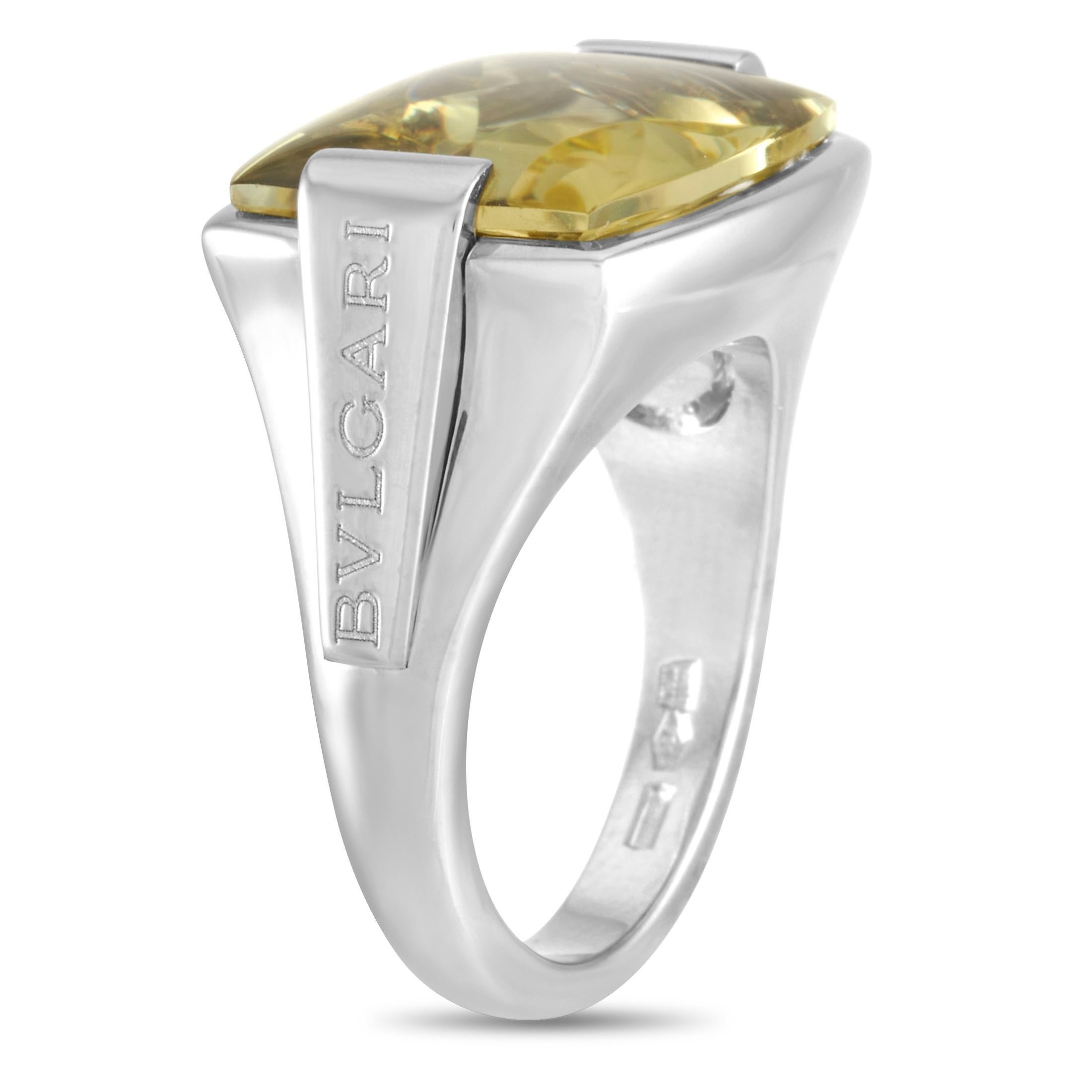 This Bvlgari ring is crafted from 18K white gold and set with a lemon citrine. The ring weighs 12.1 grams. It boasts band thickness of 3 mm and top height of 7 mm, while top dimensions measure 13 by 18 mm.