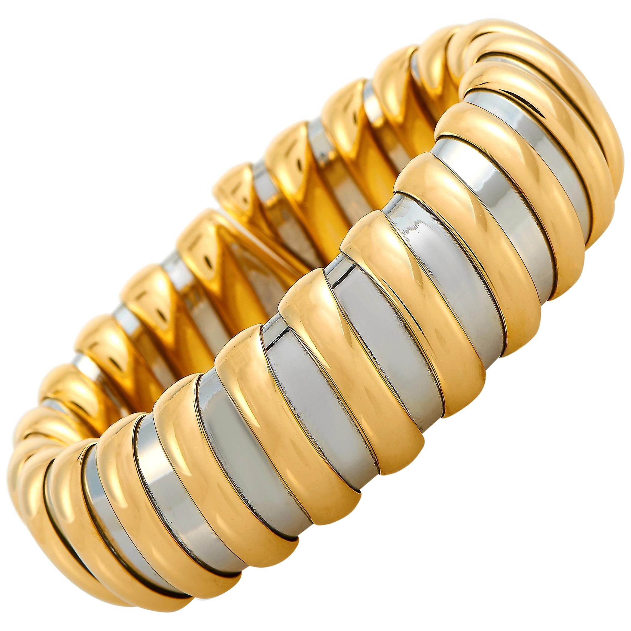 This Bvlgari bracelet is made out of 18K yellow gold and stainless steel and weighs 89.1 grams. It measures 7.85” in length and boasts a 2.50” diameter.
 
 The bracelet is offered in estate condition and includes the manufacturer’s box.