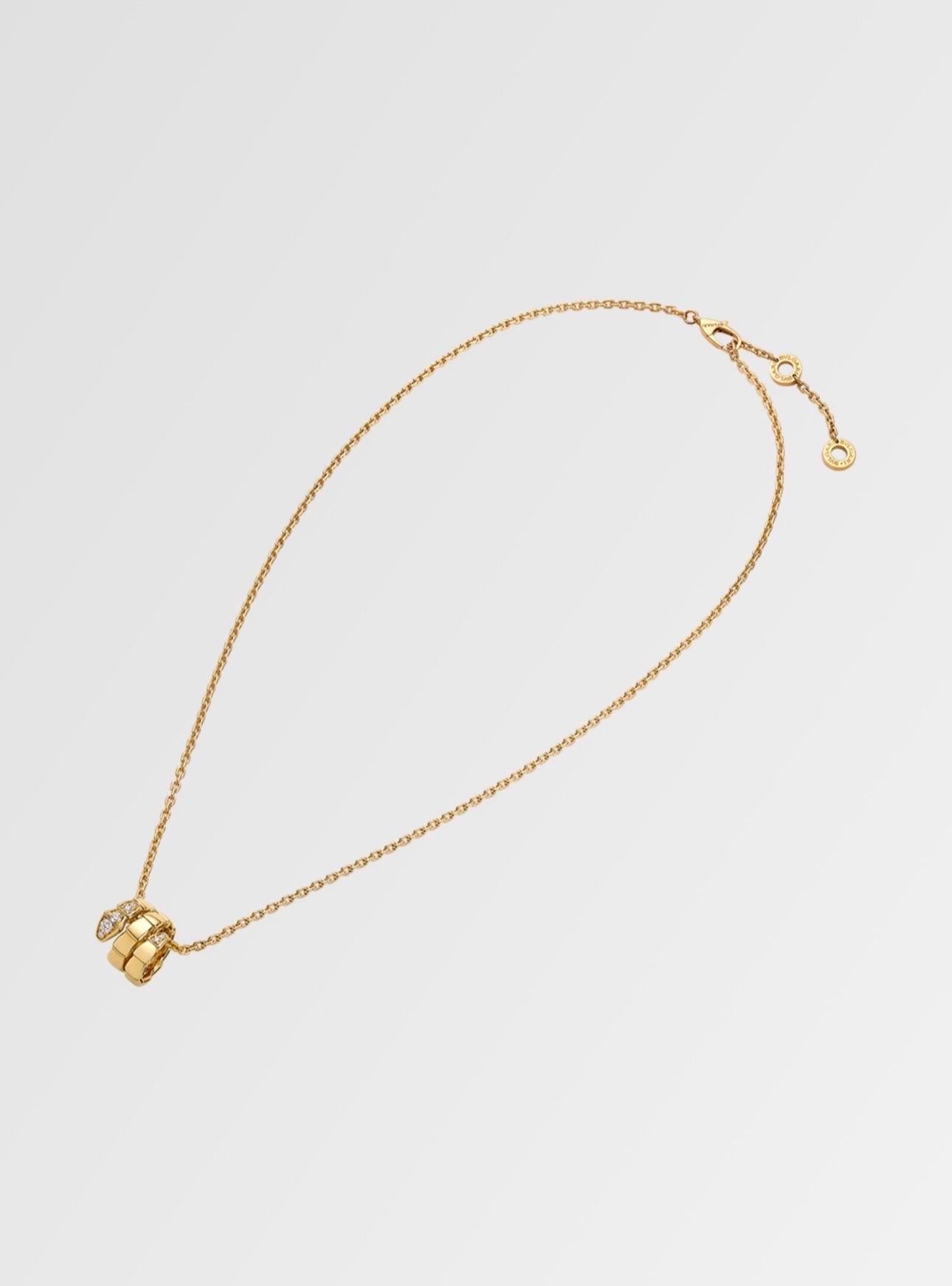 Serpenti Viper 18 karat yellow gold pendant necklace set with pavé diamonds on the head and tail
Weight of the Necklace 11.5 gm
20 Inch long but adjustable to 18 Inch too
With its signature blend of pure aesthetics, enveloping shapes and charismatic