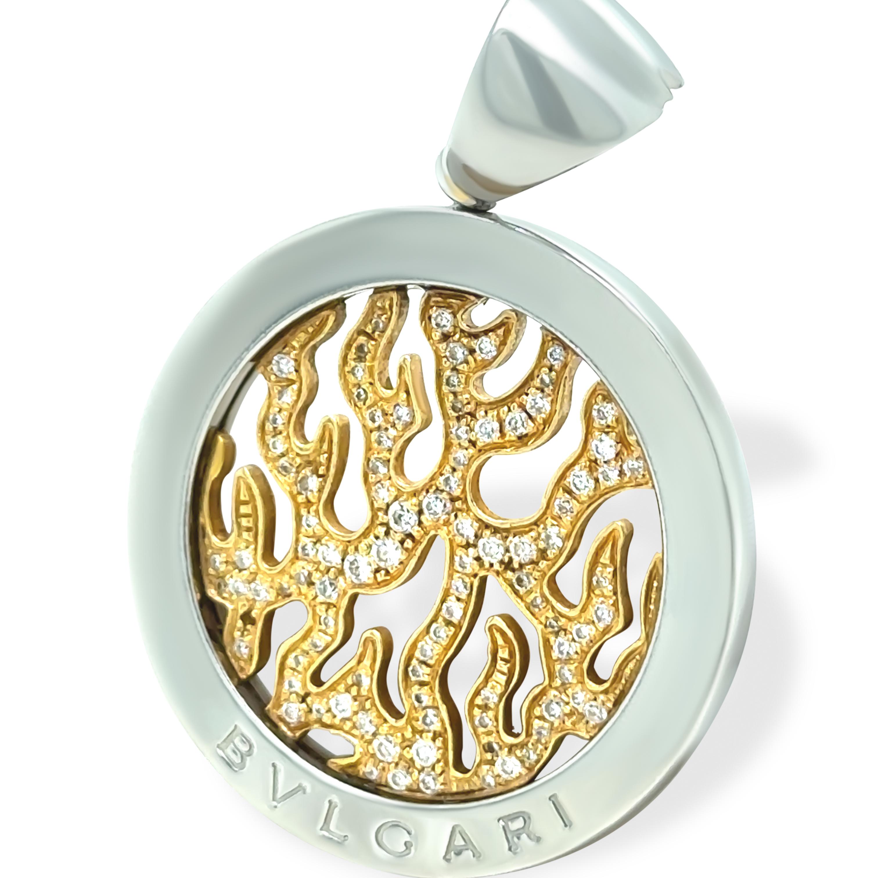 This striking Bvlgari Tondo pendant is crafted in a bold combination of 18ct yellow gold (4.8g) and stainless steel (8.3g), creating a sophisticated contrast that embodies the brand’s signature Italian luxury. The circular design features Bvlgari’s