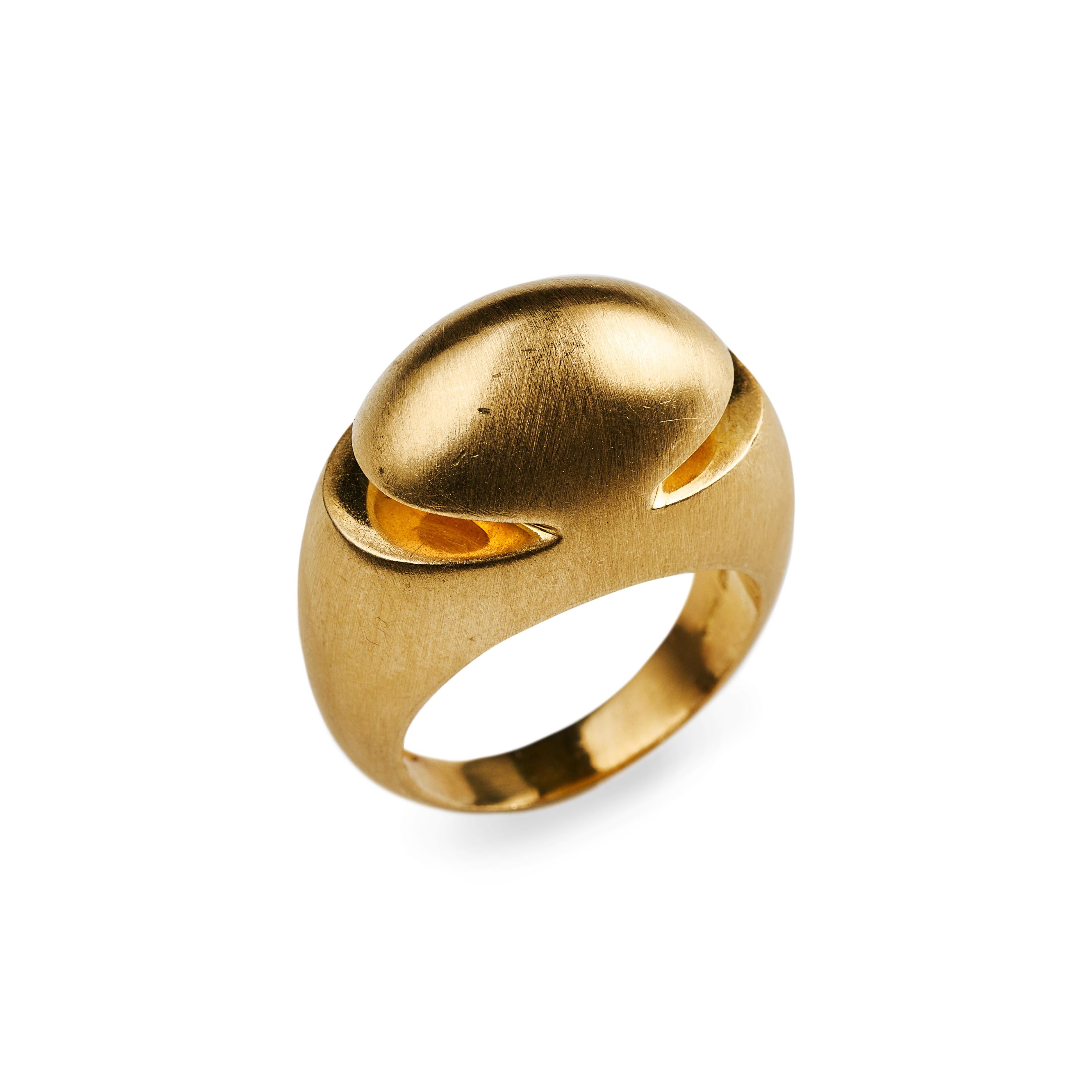 Celebrating the beauty of simplicity.
Cut-out accents elevate this design’s sleek sense of sophistication.
18K brushed gold cut dome ring by Bvlgari, designed circa 2000.

7 gram, Size 7.5, dome 11.7mm high, ring 24.3 mm wide
