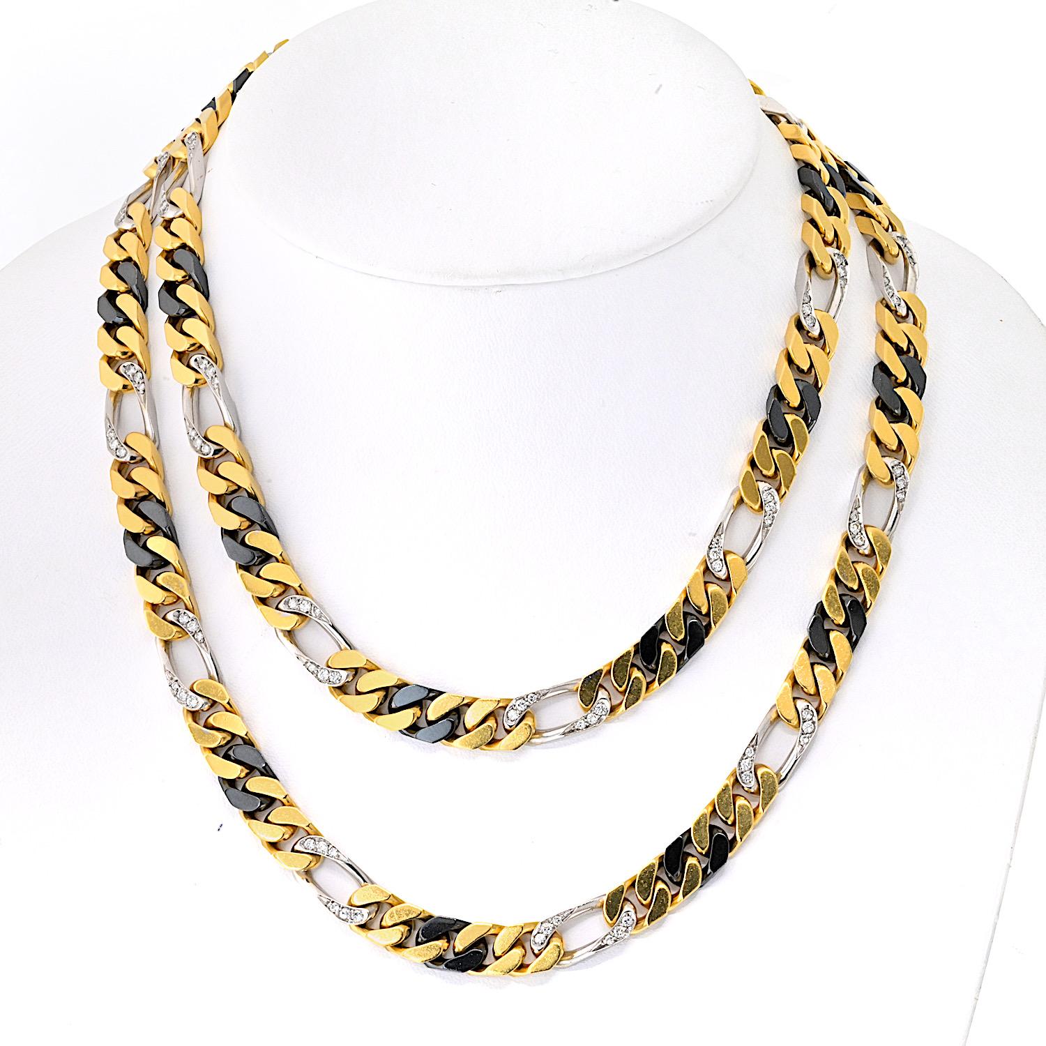 An exceptional vintage Bvlgari chain necklace, masterfully crafted in 18k gold with a bold and luxurious tri-color design. This 35-inch statement piece features an intricate pattern of yellow gold links, black rhodium-applied black gold links, and