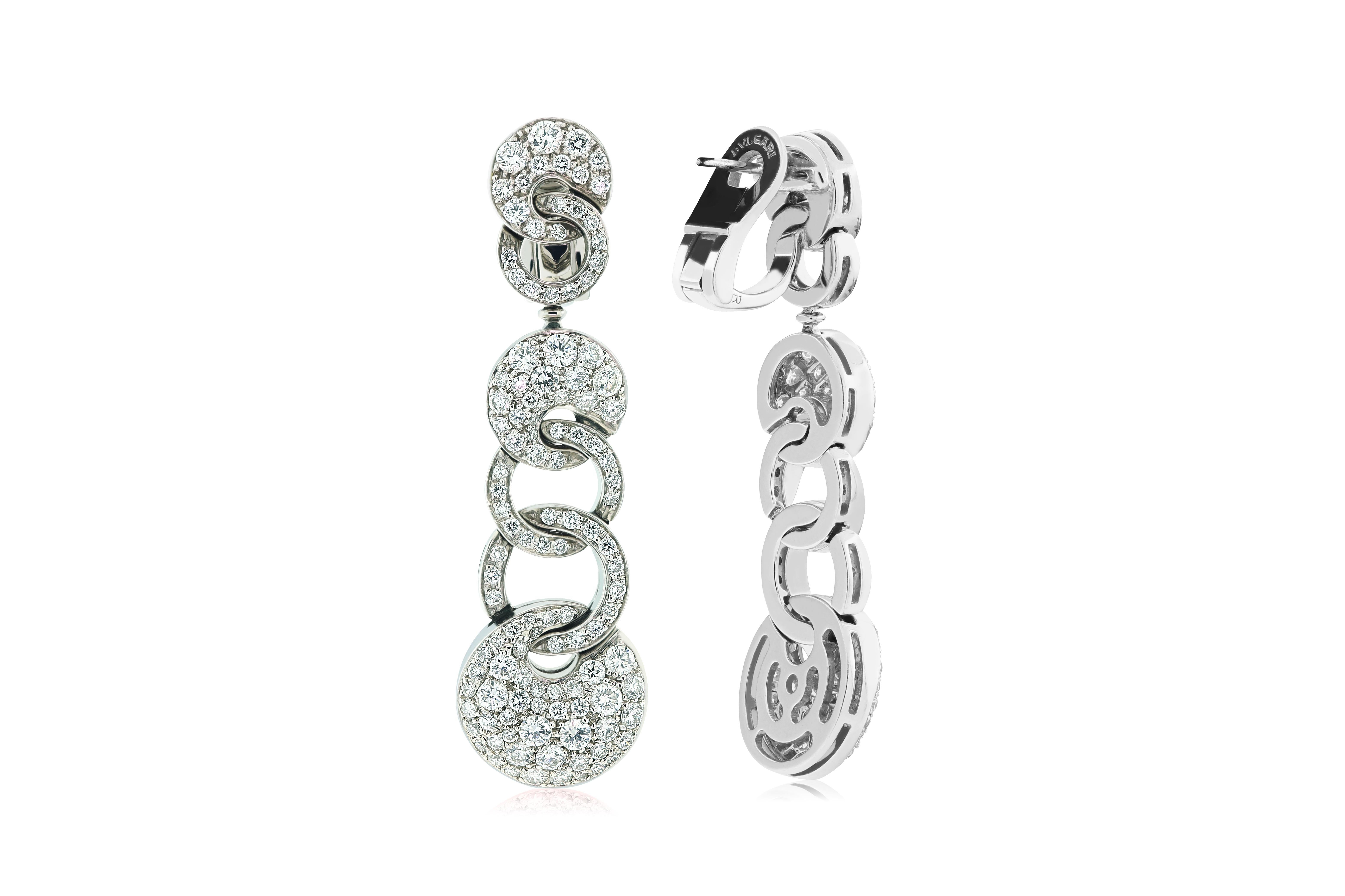 The BVLGARI dangle earrings feature approximately 2 carats of diamonds set in 18K white gold. Post back clip combo. Inscribed BVLGARI.