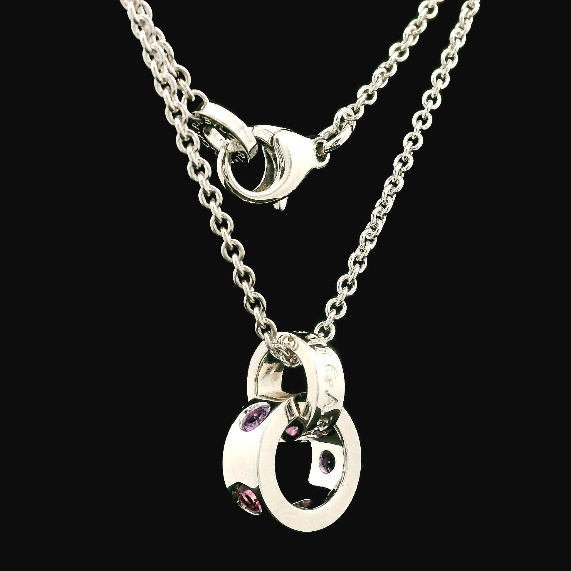 –Stone(s)–
(3) Natural Genuine Tourmaline - Round Brilliant Cut - Bezel Set - Soft Pink Color - 2.69mm (approx.) 
(2) Natural Genuine Amethyst- Round Brilliant Cut - Bezel Set - Light Purple Color - 2.82mm (approx.) 

Material: Solid 18k White