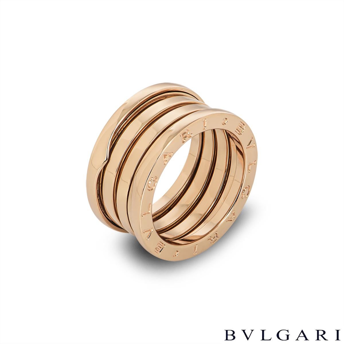 A classic 18k rose gold ring by Bvlgari from the B.Zero1 collection. The ring comprises of 3 spiral design bands with the iconic 'Bvlgari Bvlgari' logo engraved around the outer edges. The ring is a UK size O/ US size 7 and has a gross weight of