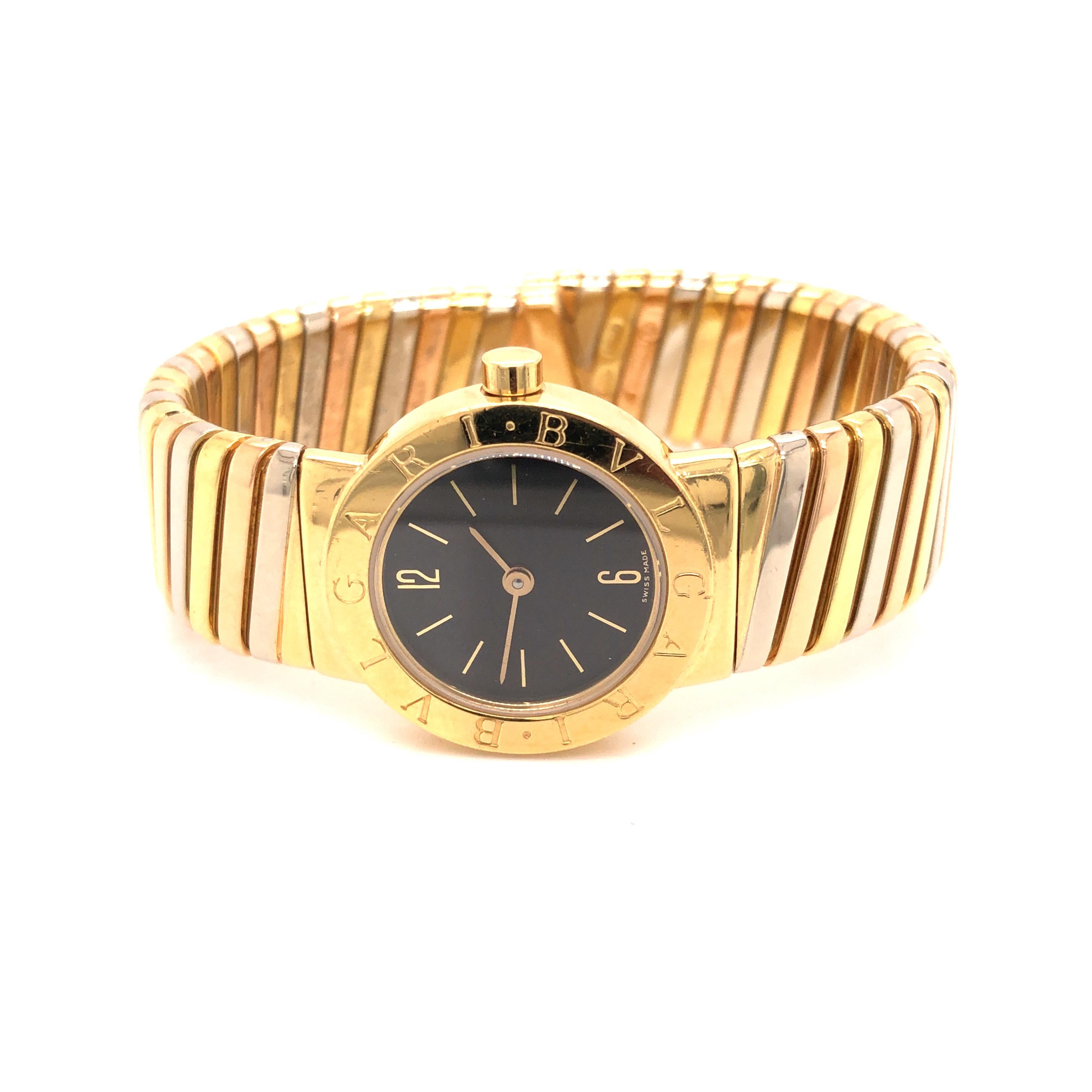 This vintage Swiss made Bvlgari watch is made of 18K white and yellow gold. The case is 24 mm with black dial and gold sticks. Arabic numerals at the 12 & 6 hour markers. 
The watch is currently not in working order.

Weight: 83.5 grams
