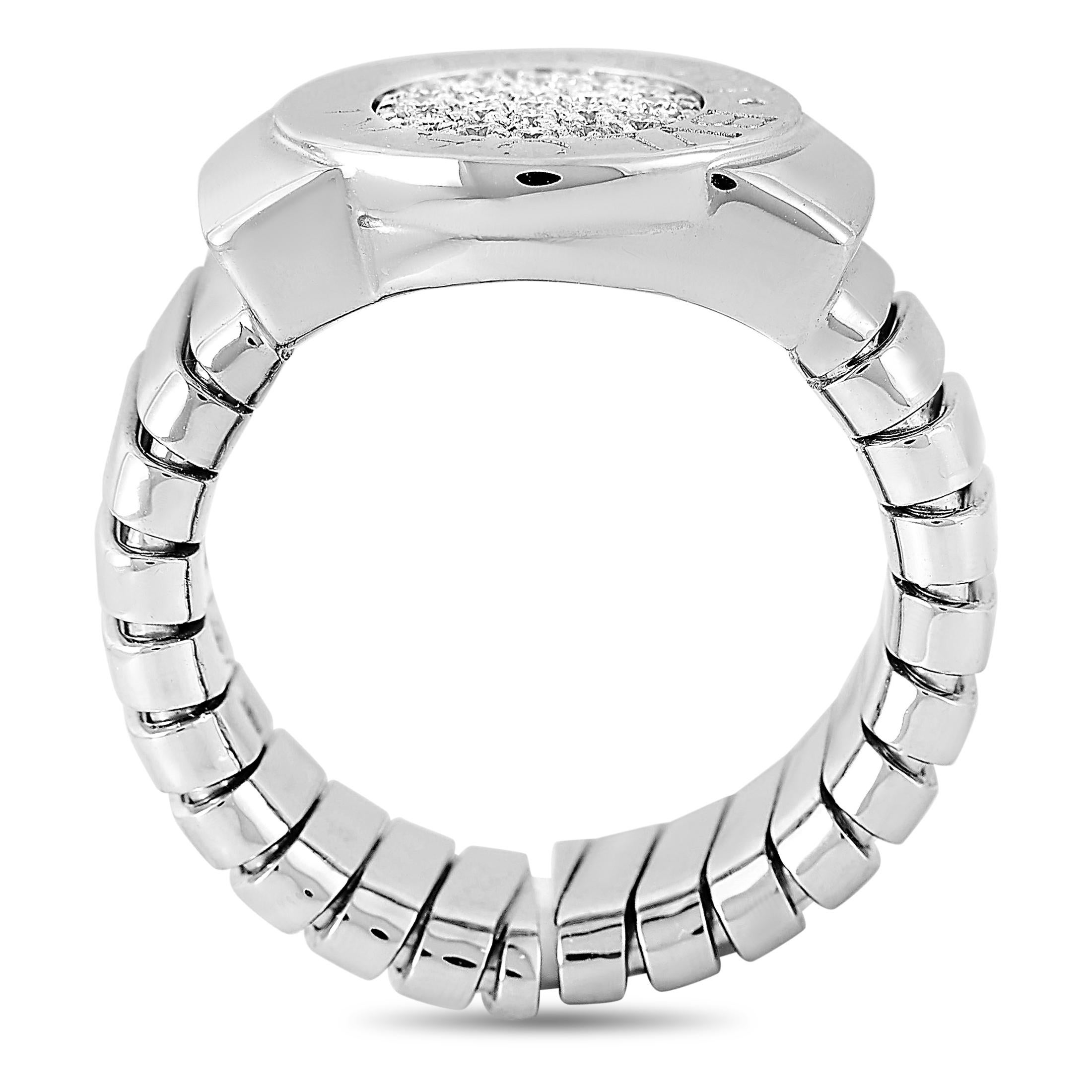 This Bvlgari tubogas ring is made of 18K white gold and embellished with diamonds that amount to 0.20 carats. The ring weighs 17.1 grams and boasts band thickness of 8 mm and top height of 3 mm, while top dimensions measure 17 by 13 mm.
 
 Offered