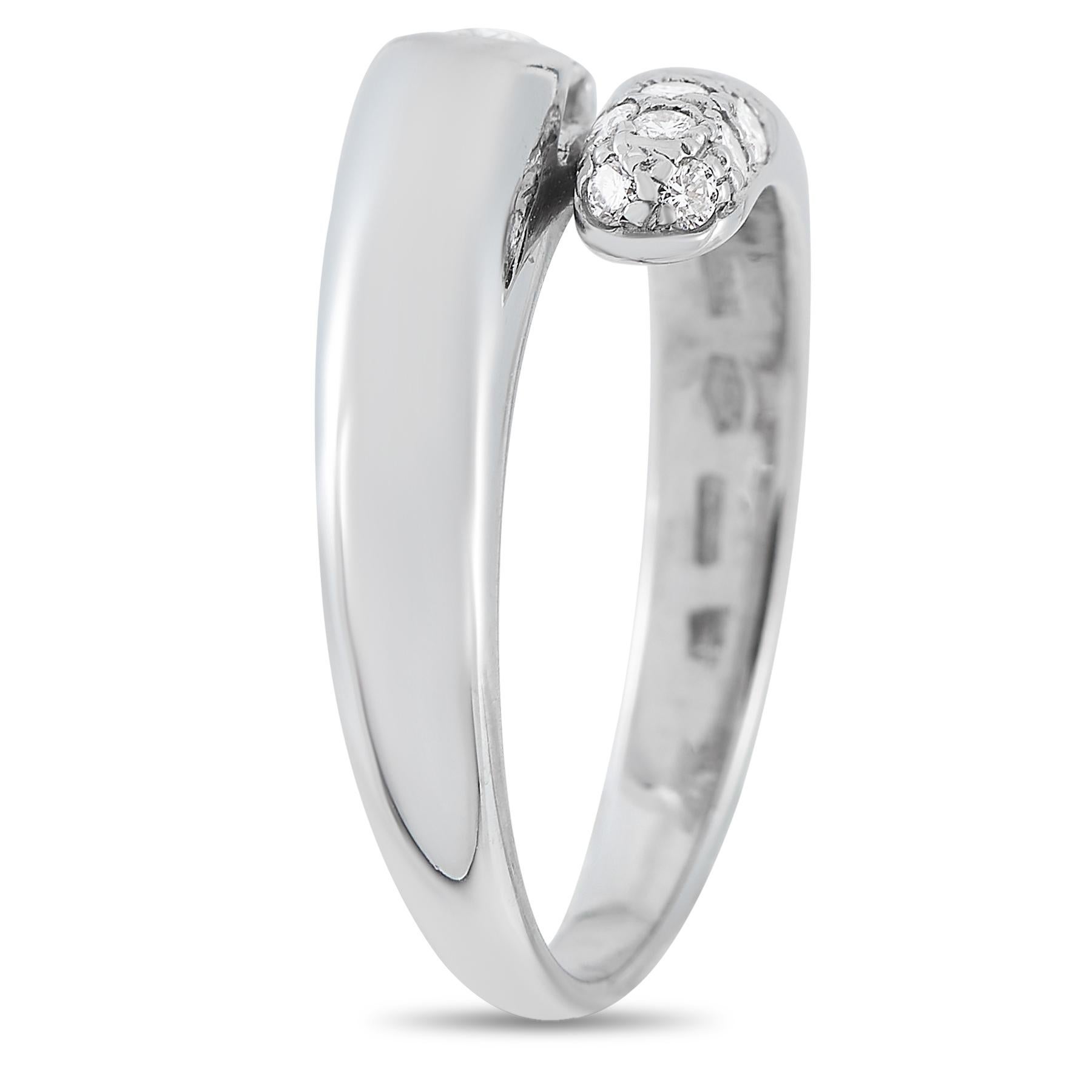 A Bvlgari diamond ring that can transform your look from simple to sophisticated in seconds. This white gold ring has a bypass-style shank. One end is detailed with 0.10 ct diamonds in pave setting while the other end bears a single 0.48 ct diamond.