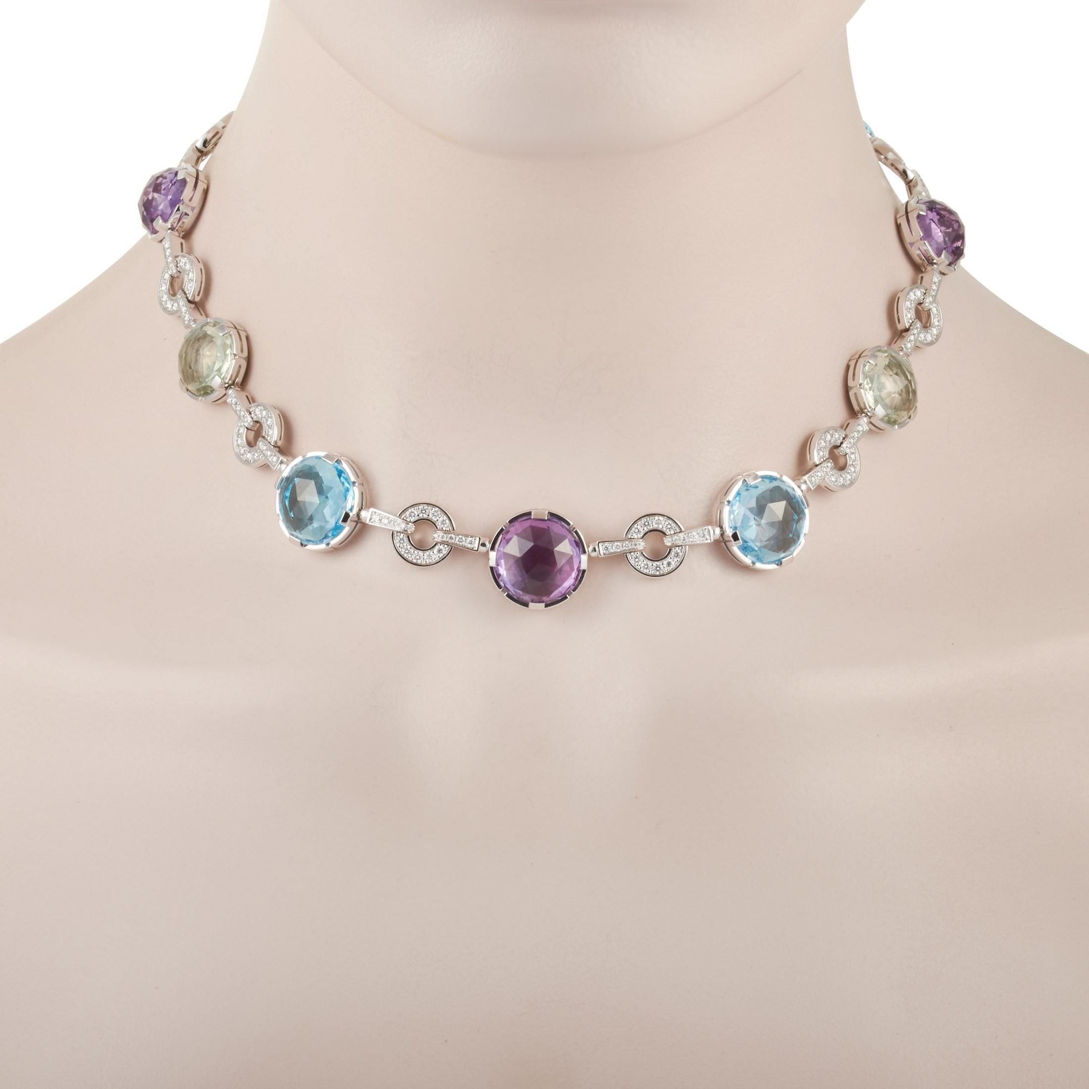 This Bvlgari 18K White Gold 2.60 ct Diamond, Topaz and Amethyst Parentesi Cocktail Necklace is a statement piece that will have people talking. It features an 18K White Gold chain that is 15 inches in length and is punctuated with Amethyst, Topaz,