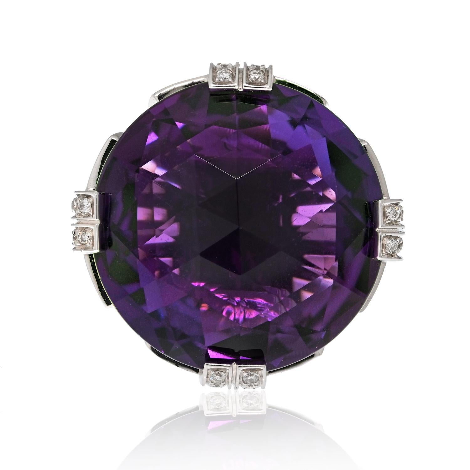Prepare to be captivated by the timeless elegance of this estate Bvlgari ring. Crafted in 18 karat white gold, this exquisite piece showcases a round faceted amethyst as its centerpiece, surrounded by a dazzling display of round brilliant cut