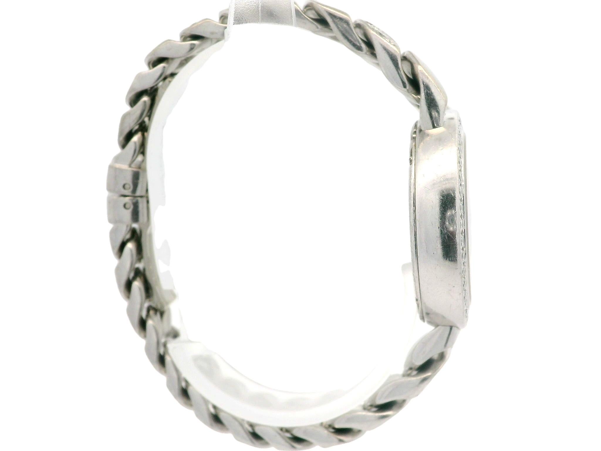 Case Material: 18k White Gold
Height: 31.4mm (lug to lug)
Case Size: 31mm (Not including the crown)
Band Material: 18k White Gold
Band Length: Fits up to 6.25 inch wrist
Thickness: 8.2mm
Watchmaker: Bvlgari
Movement: Swiss - Quartz 
Weight: 108.3