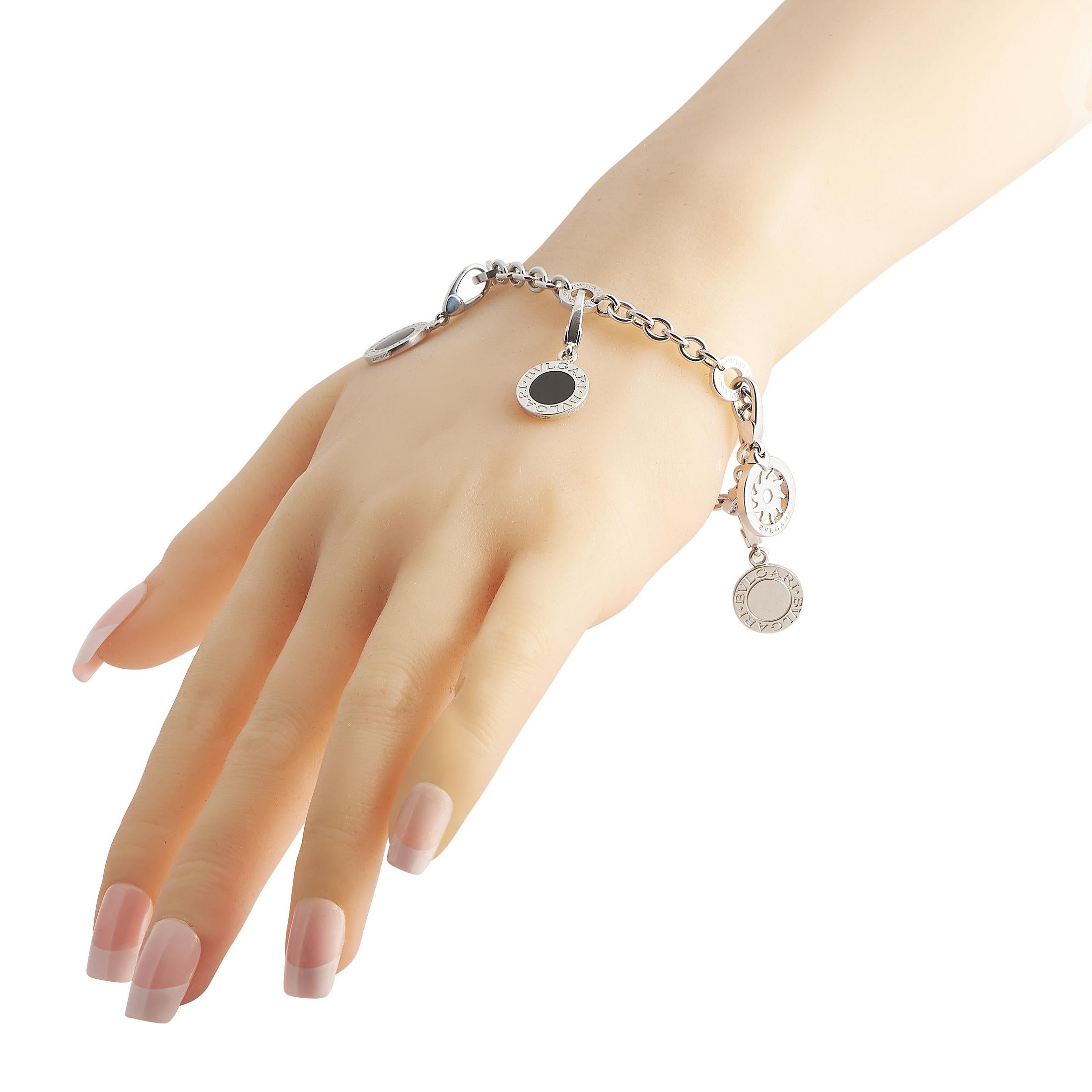 A classic piece of jewelry gets a contemporary upgrade in the form of this elegant Bvlgari charm bracelet. The shimmering 18K White Gold chain measures 7” long and is elevated by the presence of the brand’s signature. It’s adorned with a series of 5