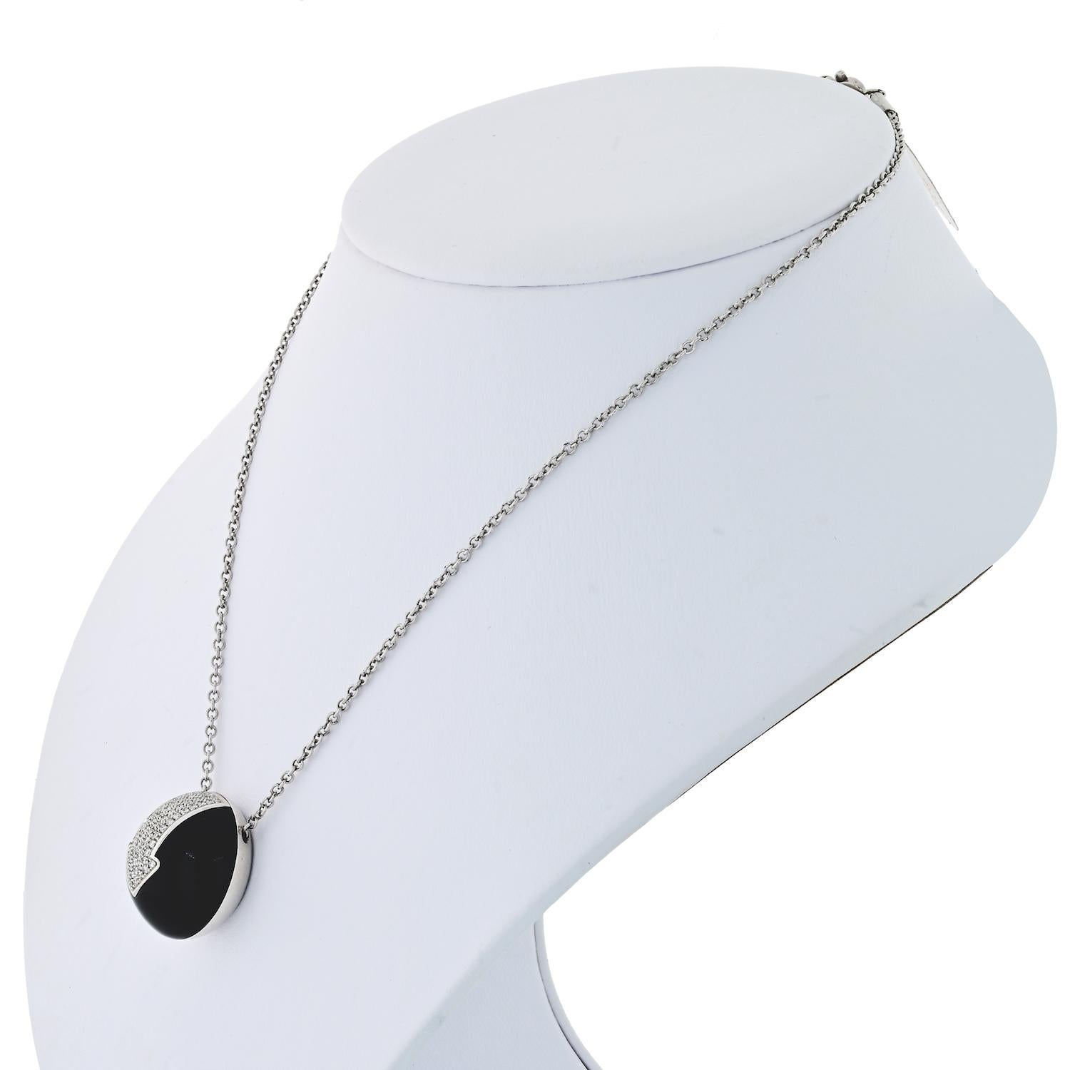 Elegant diamond Jet circle pendant by Bvlgari Gianni Enigma. 

Chain: 14 inches
Pendant: 0.75 inches.