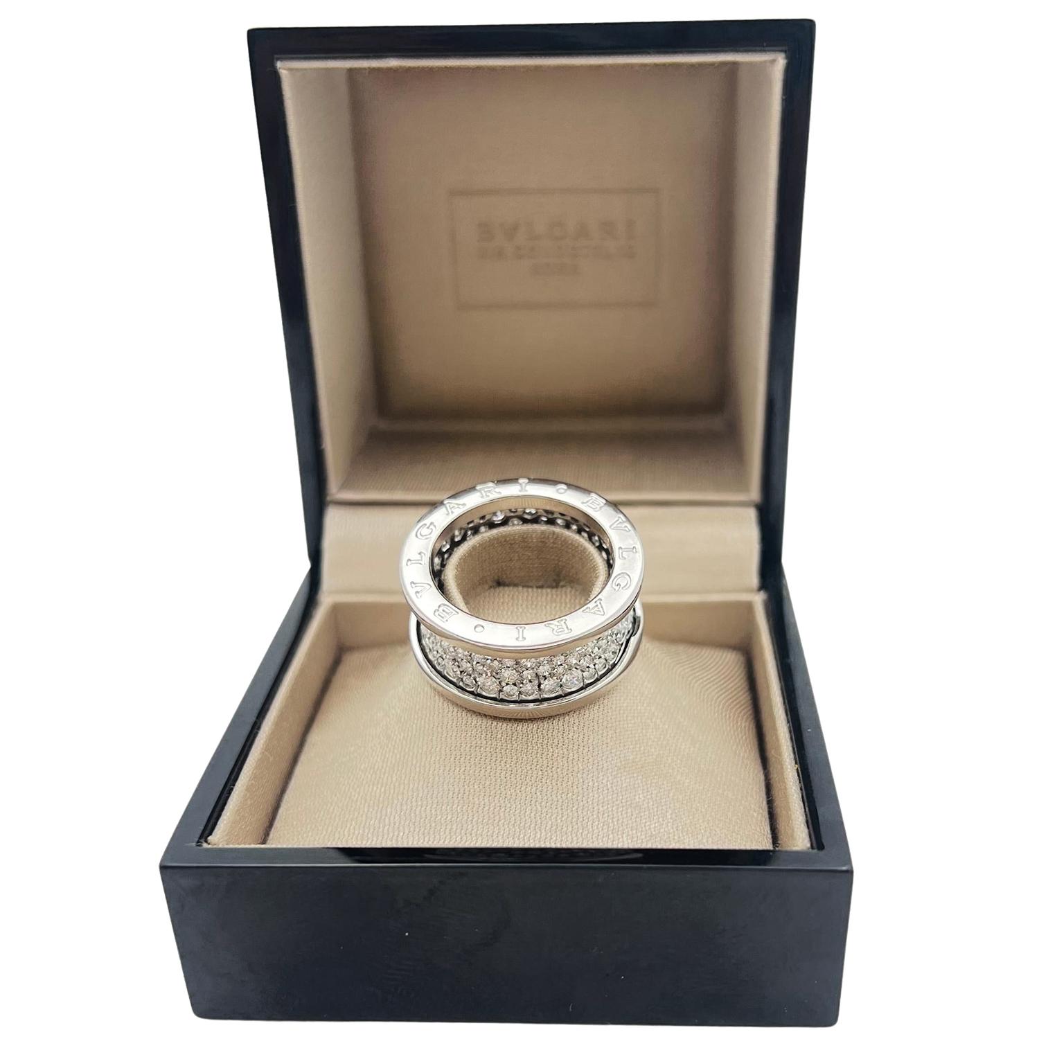 Bvlgari B.Zero 1 band ring in 18k white gold, featuring pave-set round brilliant-cut diamonds flanked by a polished 18k white gold rim with 'BVLGARI' engraved on both outside flat edges.  Diamonds weighing approximately 2.24 total carats.  Color: