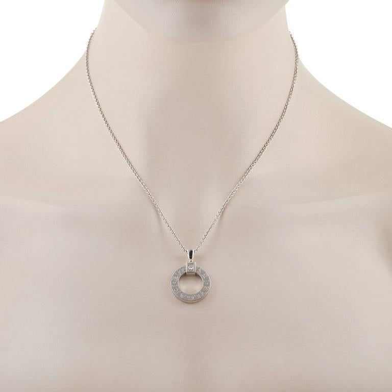 A breathtaking piece from Bvlgari, this stylish pendant necklace boldly displays the luxury brand’s signature. Crafted from 18k White Gold, it features a minimalist pendant that measures 1.13” long and .75” wide suspended from a 17” chain. A single