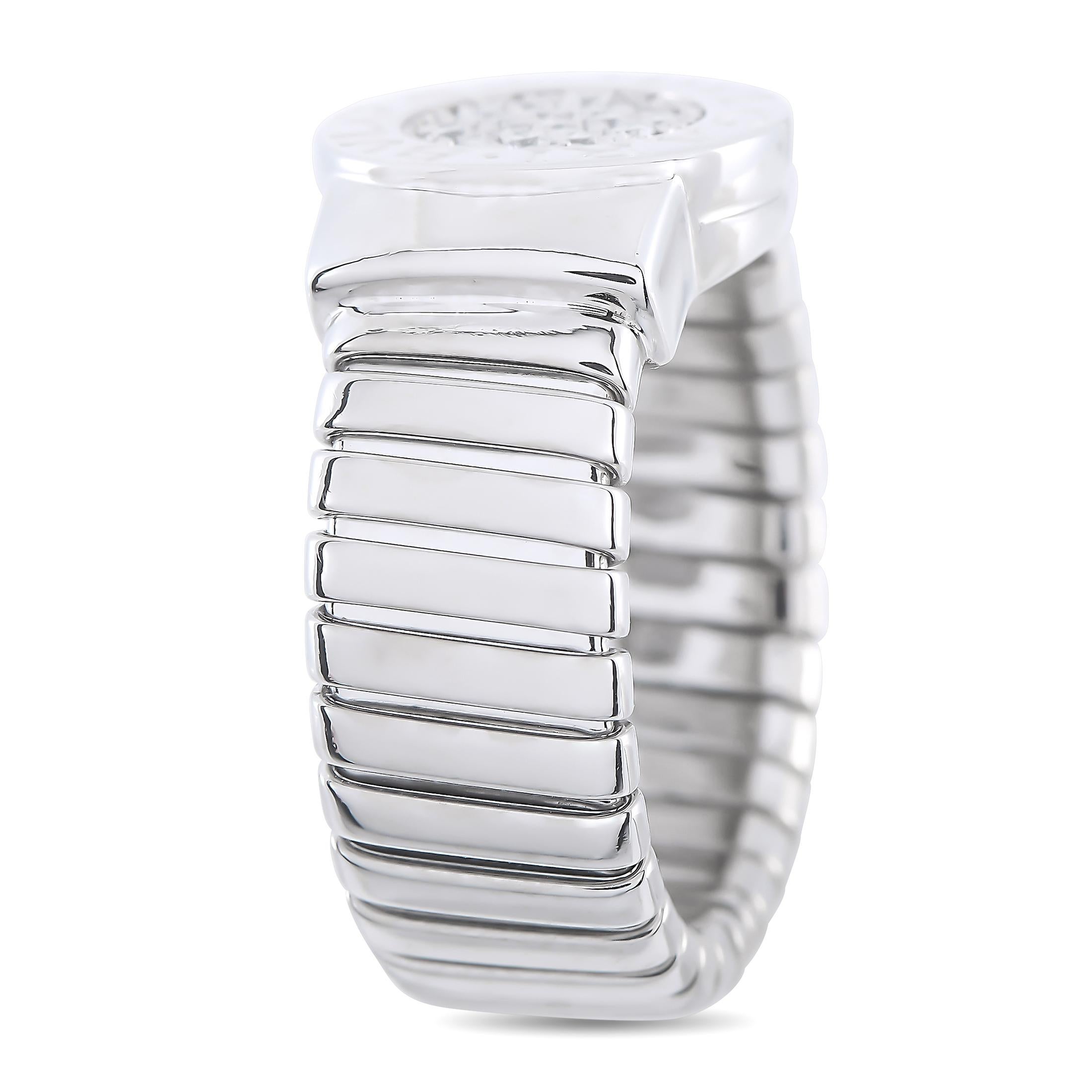 A unique design makes this Bvlgari ring simply unforgettable. Crafted from 18K White Gold, the setting features a textured band measuring 8mm wide. A circular motif at the center of the design serves as a stunning focal point thanks to inset