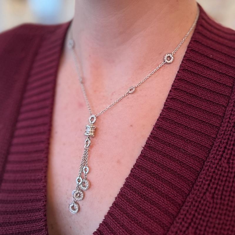 This Bvlgari Lariat necklace is an easy addition to any collection. The elegant 18K white gold piece can be worn as part of a stack or used as a stand alone piece. The chain is intertwined with 4 white gold, round pendants set with diamonds. A