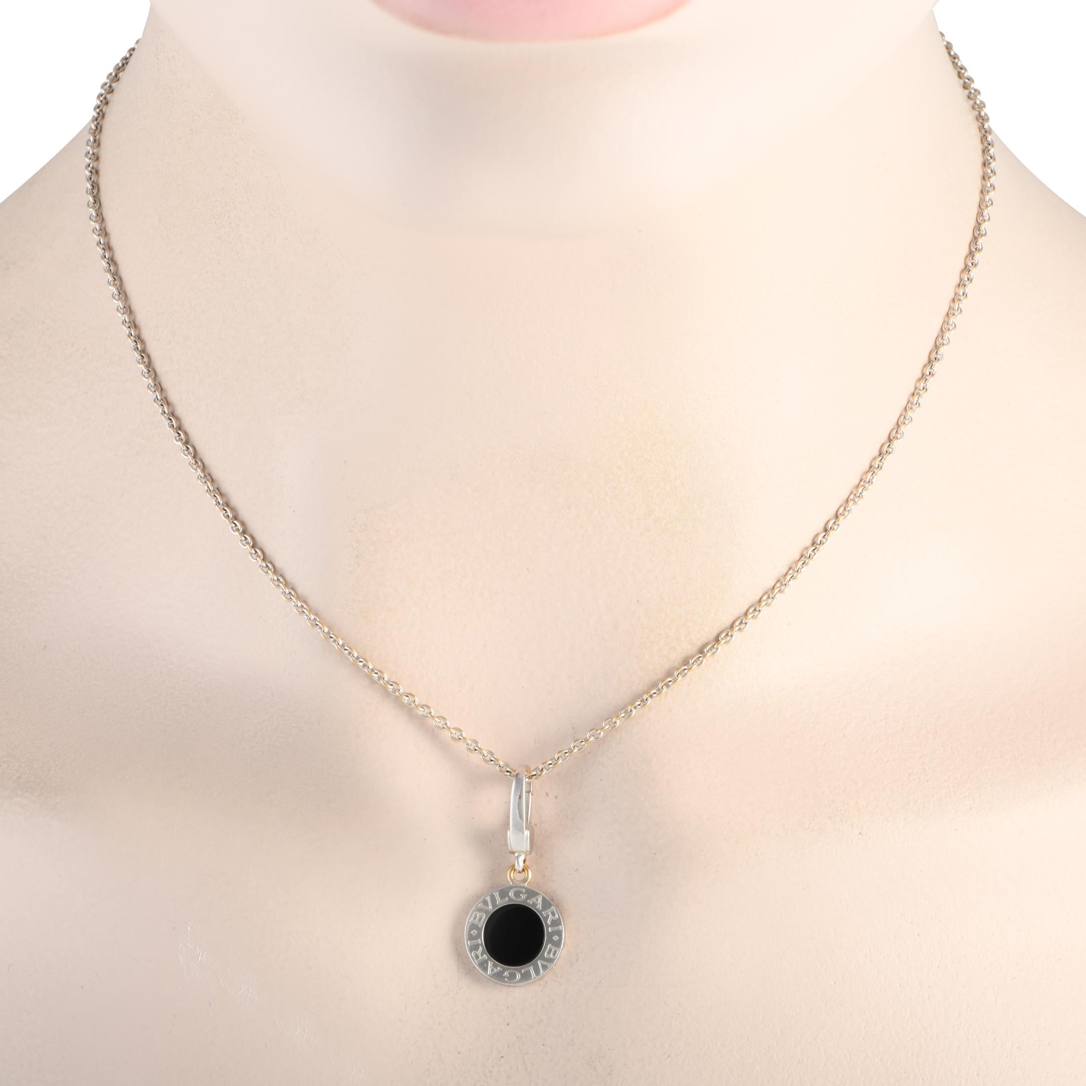 This simple, elegant Bvlgari necklace will serve as a luxurious addition to any ensemble. Suspended from a sleek 16” chain, you’ll find an 18K White Gold pendant measuring 1.0” long and 0.5” wide - It’s elevated by a singular onyx stone and the