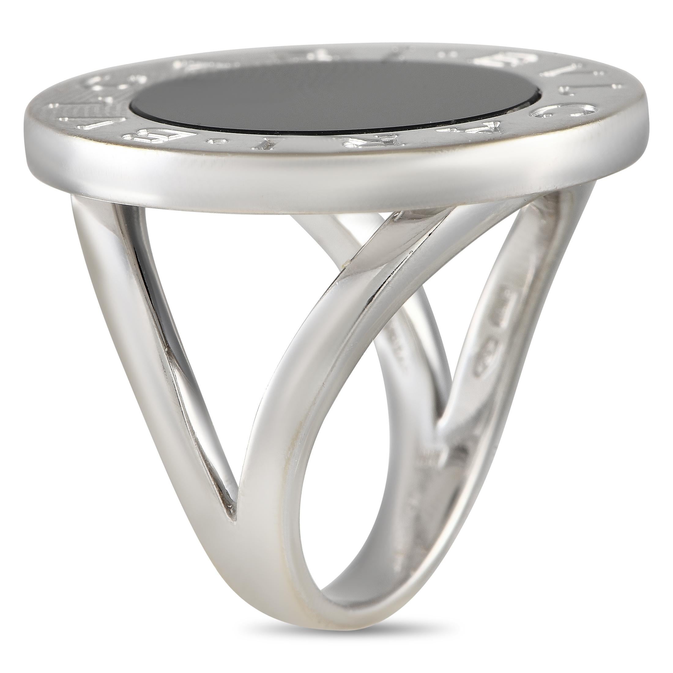 This Bvlgari ring is destined to continually make a statement. The 18K White Gold setting features a delicate 4mm wide band and a top height measuring 3mm. A circular Onyx stone serves as a stunning focal point, while the brand\u2019s name engraved