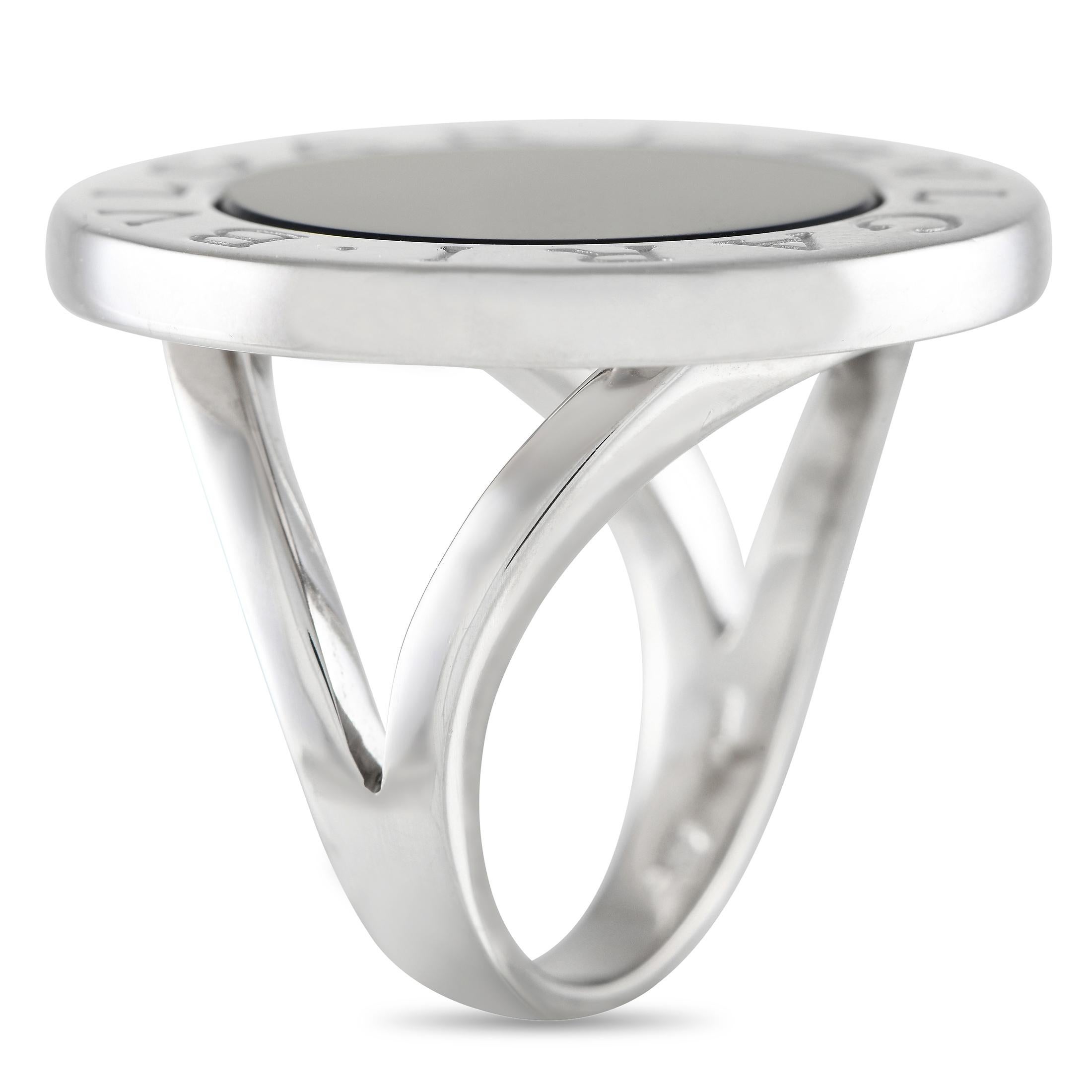 Stylish and elegant, this Bvlgari ring is timeless in design. A circular Onyx stone sits at the center of a simple 18K White Gold setting, which also includes the luxury brand’s signature engraved around the perimeter. This piece features a band