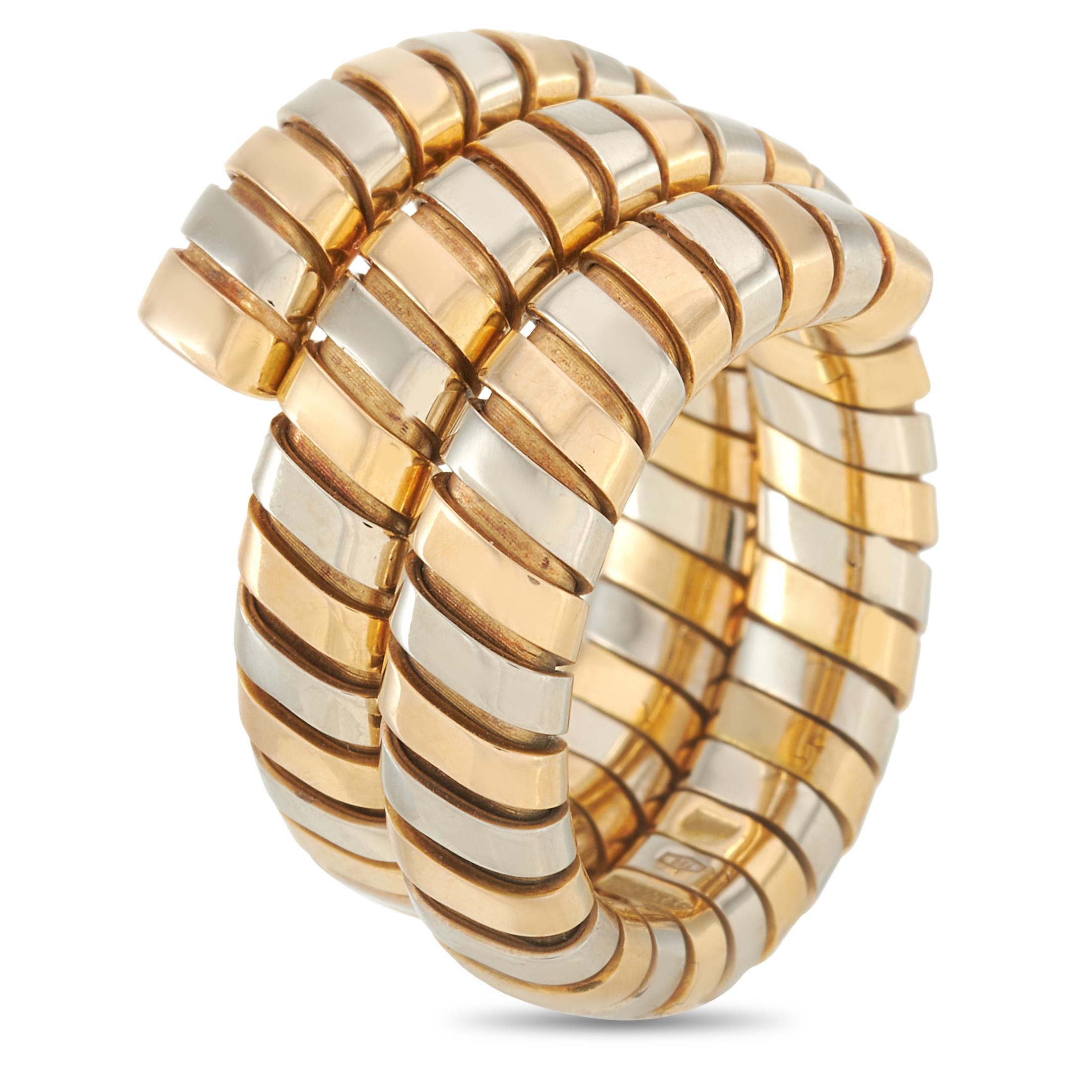 This Bvlgari tubogas ring is made out of 18K yellow and white gold. It weighs 18.7 grams and boasts band thickness of 15 mm.
 
 The ring is offered in estate condition and includes the manufacturer’s box.