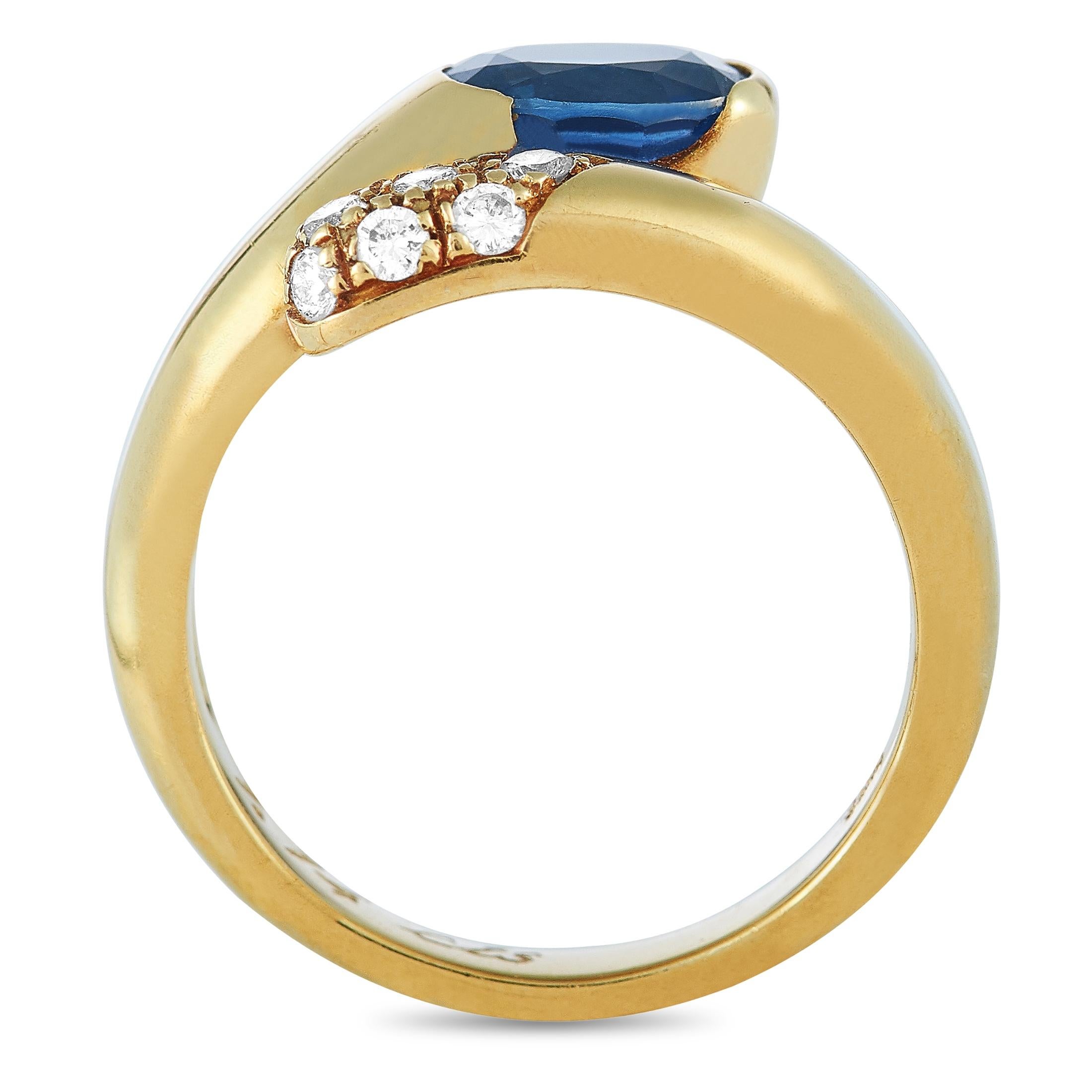 This Bvlgari ring is crafted from 18K yellow gold and weighs 5.7 grams. It boasts band thickness of 2 mm and top height of 4 mm, while top dimensions measure 10 by 9 mm. The ring is set with a 0.60 ct sapphire and a total of 0.20 carats of