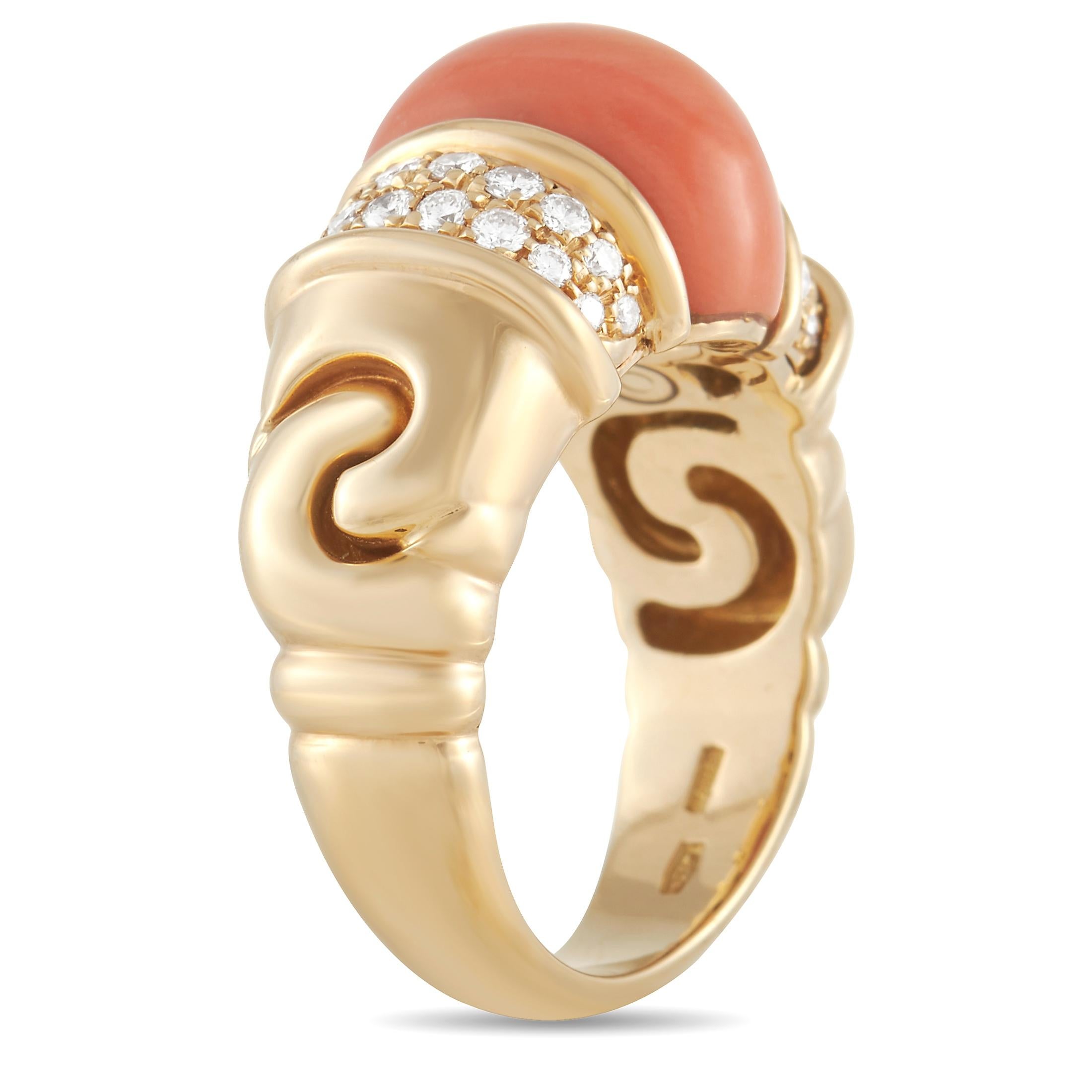 This breathtaking ring from luxury brand Bvlgari is poised to serve as an elegant addition to any jewelry collection. At the center of the stately 18K Yellow Gold setting, you’ll find an opulent coral gemstone. It’s flanked by a series of diamonds,