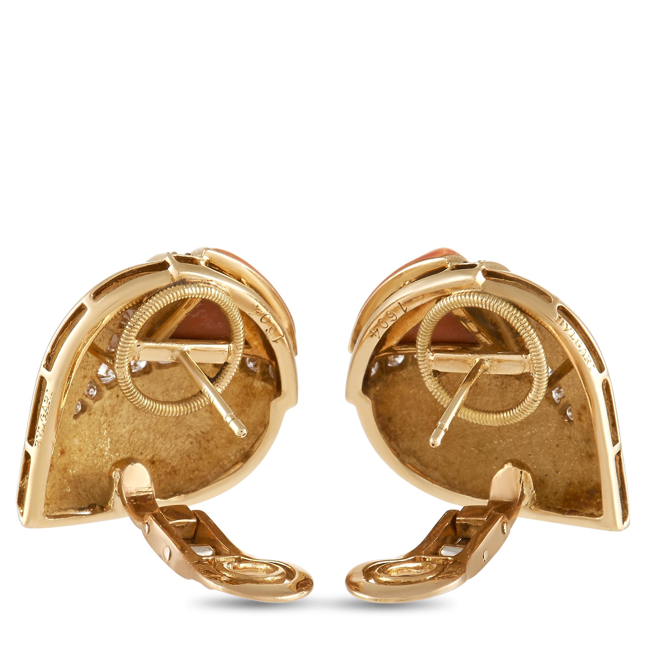 A stylish combination of luxury materials makes these Bvlgari earrings simply unforgettable. Each earring measures 1” round and juxtaposes opulent 18K Yellow Gold with inset Coral accents. Diamonds with a total weight of 1.30 carats add a touch of