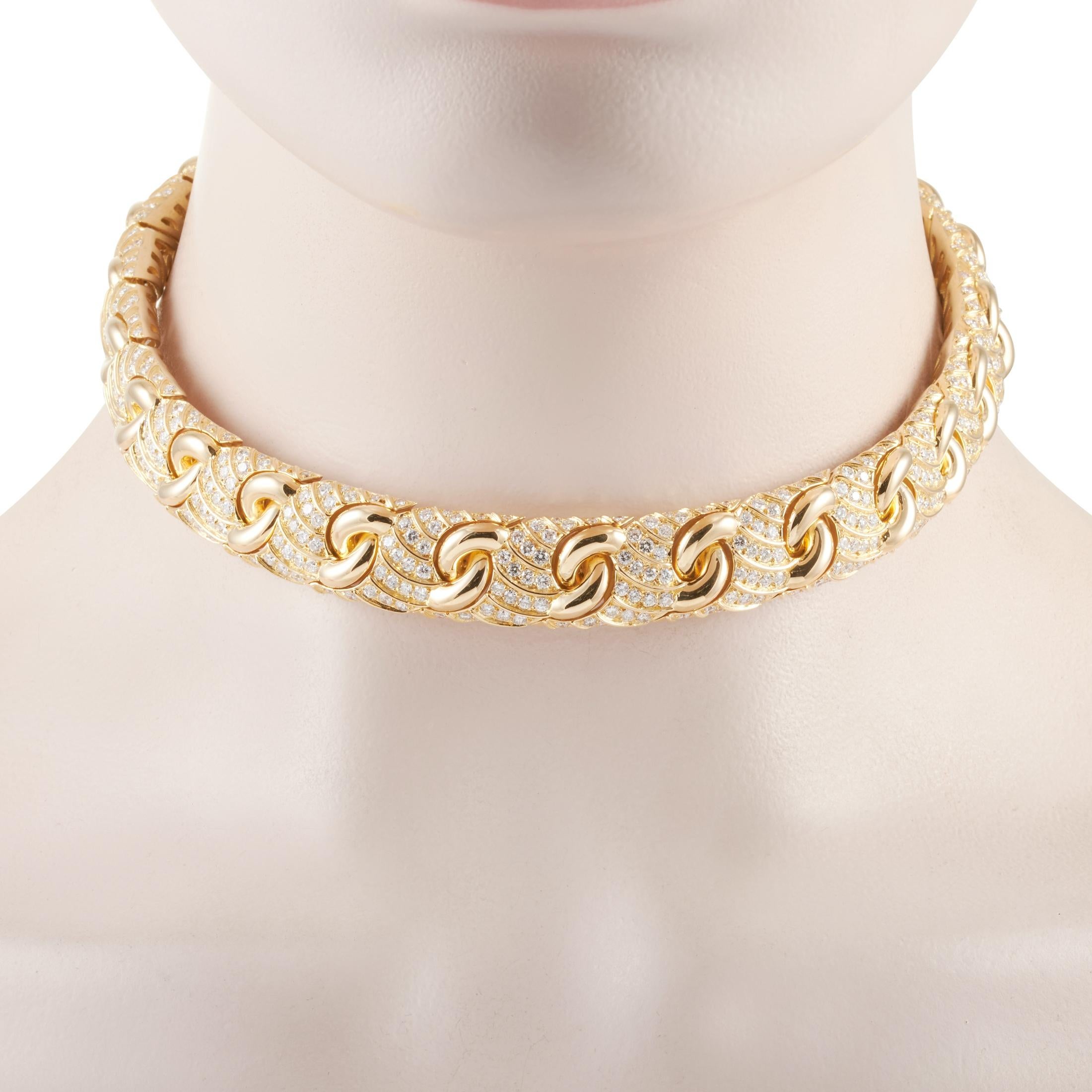 This Bvlgari necklace is made of 18K yellow gold and embellished with diamonds that boast F color and VS1 clarity and amount to approximately 15.00 carats. The necklace weighs 170.8 grams and measures 14.13” in length.

Offered in estate condition,