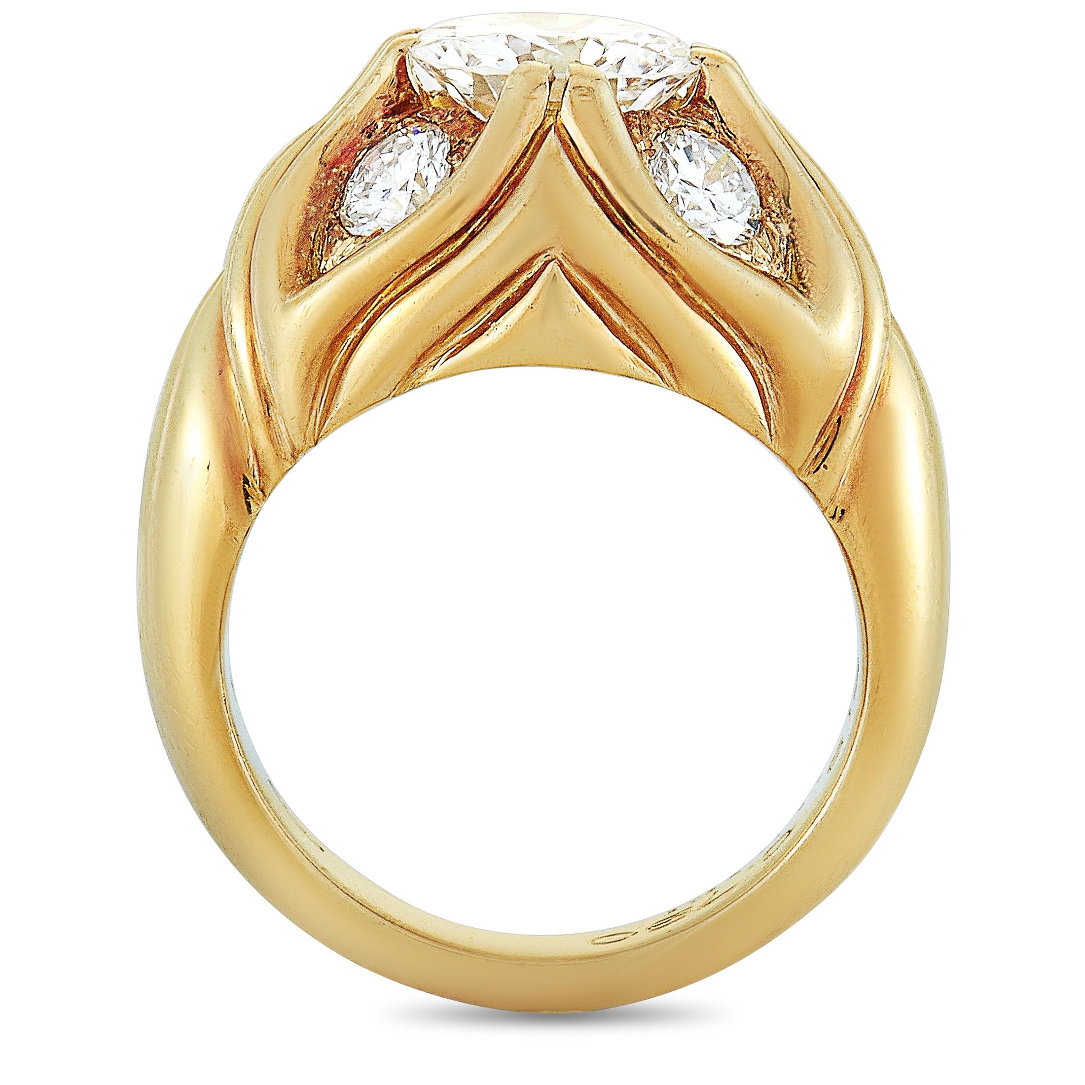 This Bvlgari ring is crafted from 18K yellow gold and weighs 15.6 grams. It boasts band thickness of 3 mm and top height of 9 mm, while top dimensions measure 16 by 14 mm. The ring is set with a total of approximately 2.60 carats of diamonds, with