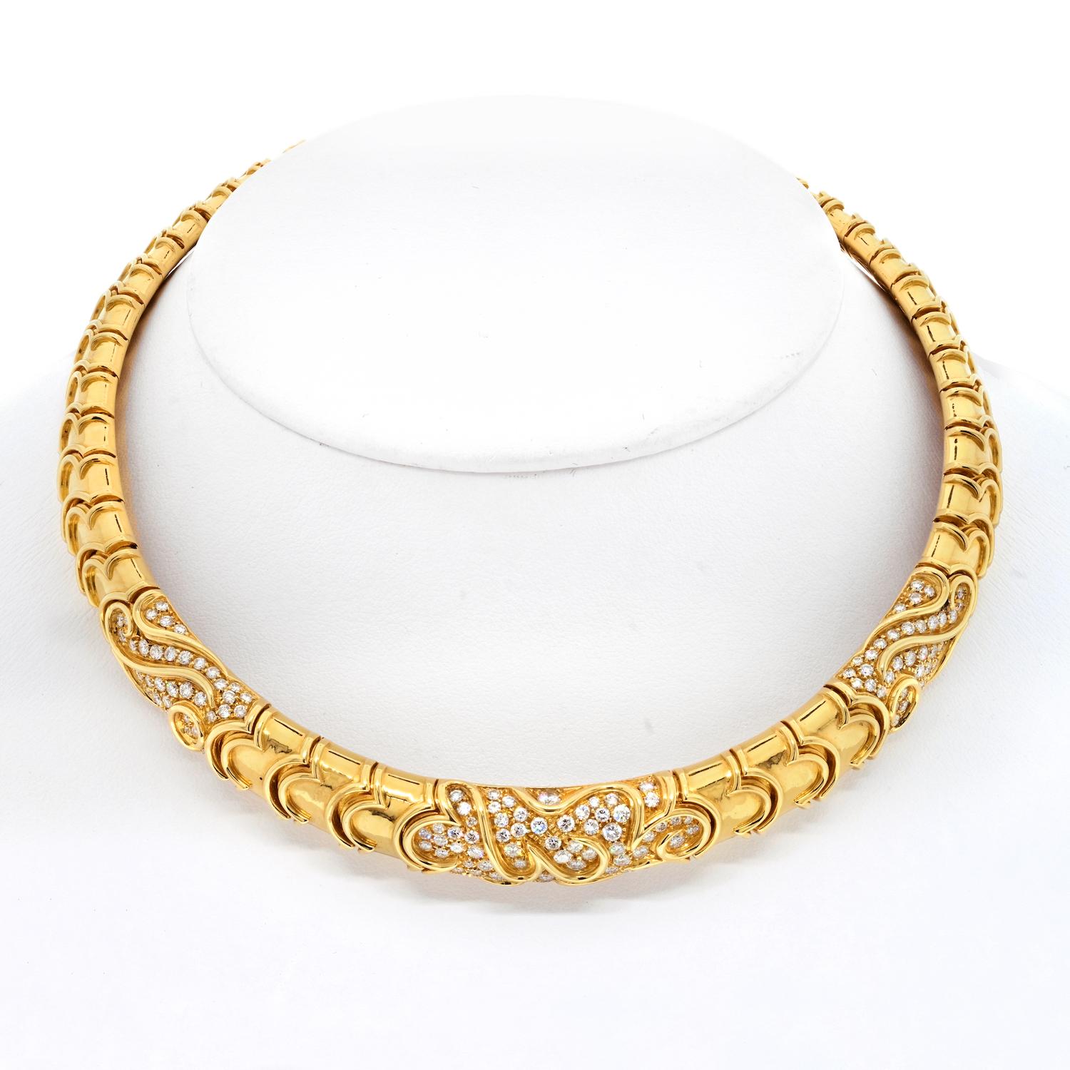 This timeless designer diamond choker is crafted in solid 18-karat yellow gold signed by Bvlgari. Brilliant-cut diamonds highlight the flexible collar necklace. 

Featuring solid gold links and decorative scrolls along with pave set diamonds this
