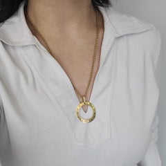 Bvlgari 18k Yellow Gold And Diamond Circle Pendant.