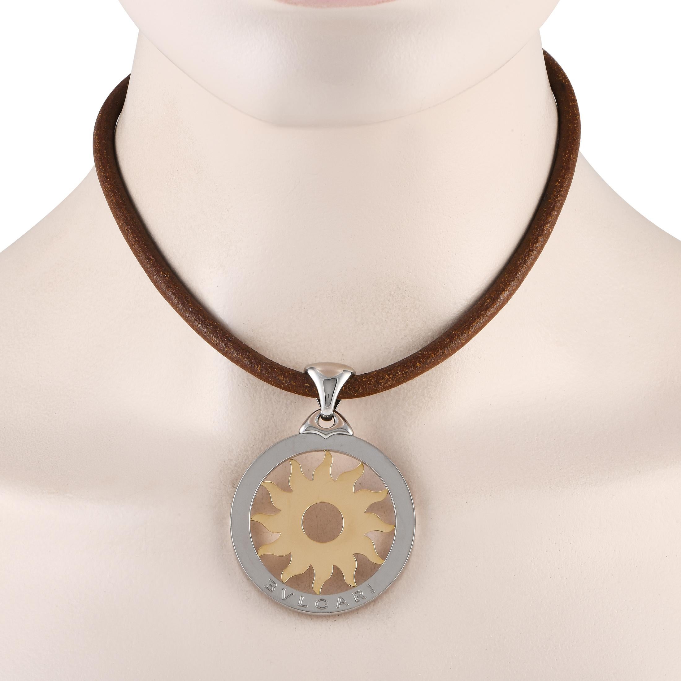 Shine a light on your fashion style with this large Bvlgari Tondo Sun necklace. On a brown leather necklace is a round pendant in stainless steel, adorned at the center with a sun motif sculpted in 18K yellow gold.This Bvlgari 18K Yellow Gold and