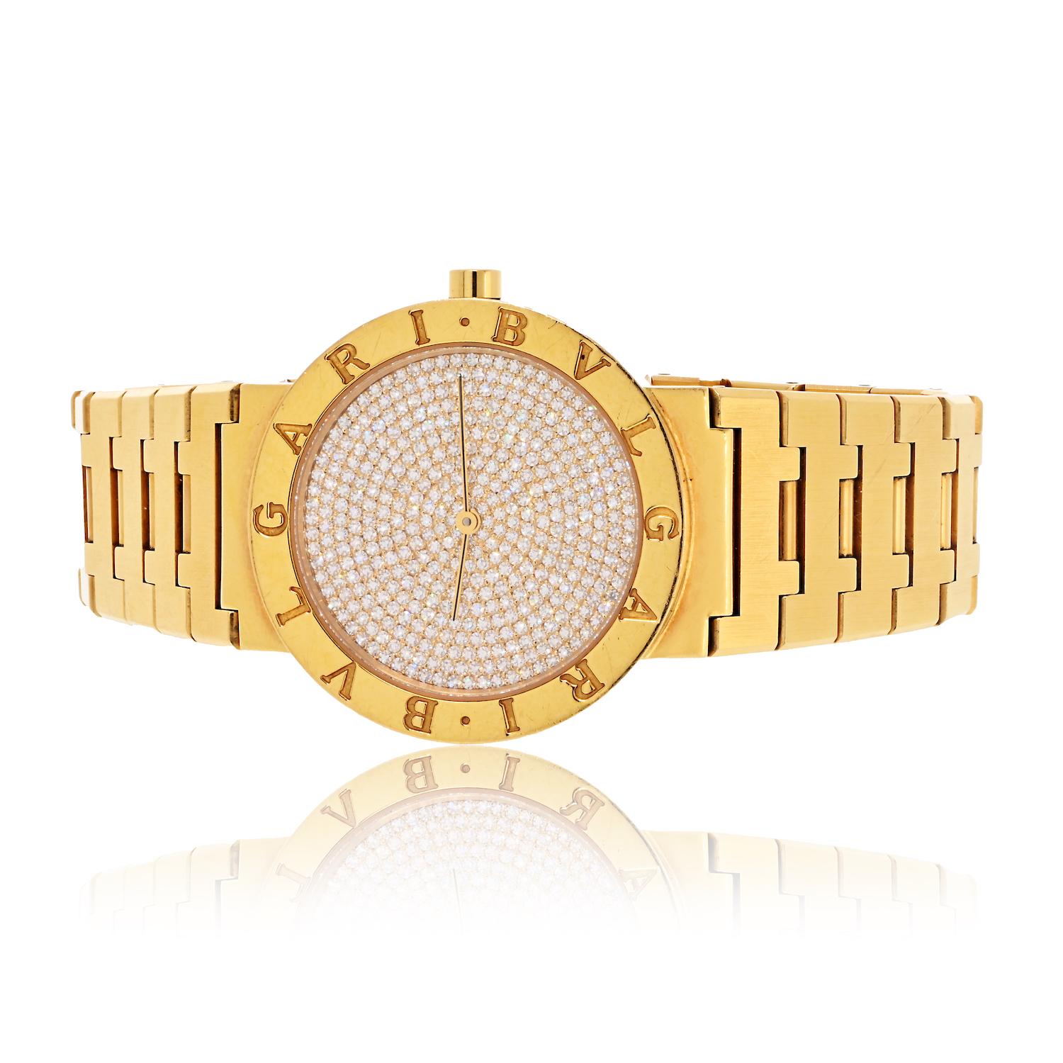 This distinguished Bvlgari Men's Diamond Dial Wristwatch, dating back to the 1990s, is a true testament to luxury and refined style. The substantial 33mm case is crafted from solid 18K yellow gold, featuring a water-resistant snap back and a