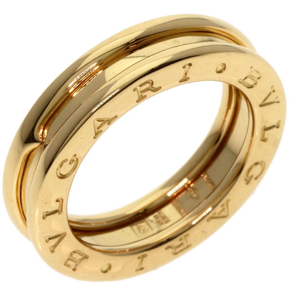 1. Elevate your jewelry collection with the exquisite BVLGARI B.ZERO 1 One Band Ring, a stunning piece crafted from luxurious 18k yellow gold. This elegant ring features the iconic BVLGARI logo, seamlessly blending sophistication with modern design.