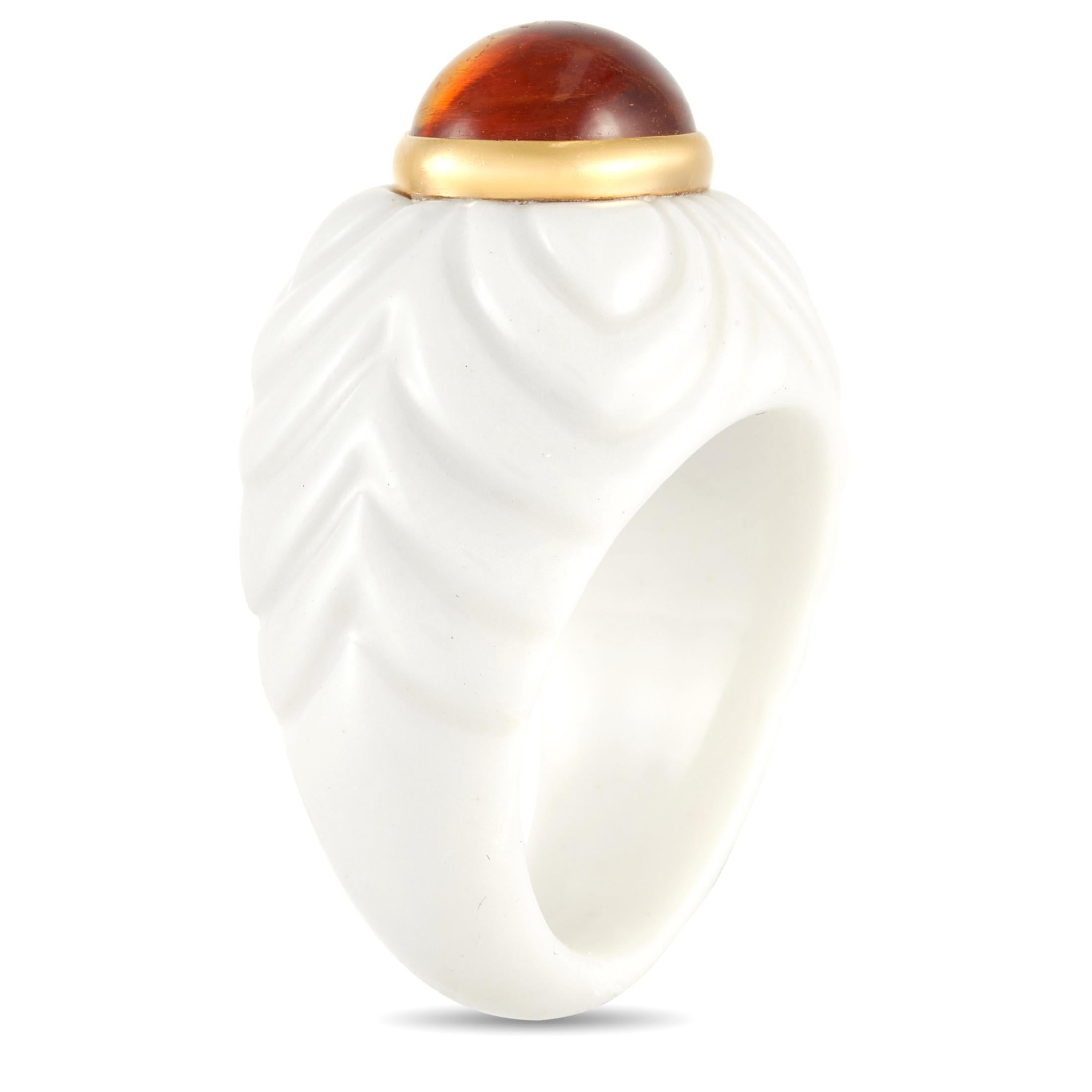 This unique Bvlgari ring is made with a clean white ceramic band in a cascading leaf or petal pattern, the ring is set with an oval citrine bezel set in 18K Yellow Gold. The ring has a band thickness of 7 mm, a top height of 11 mm, and top
