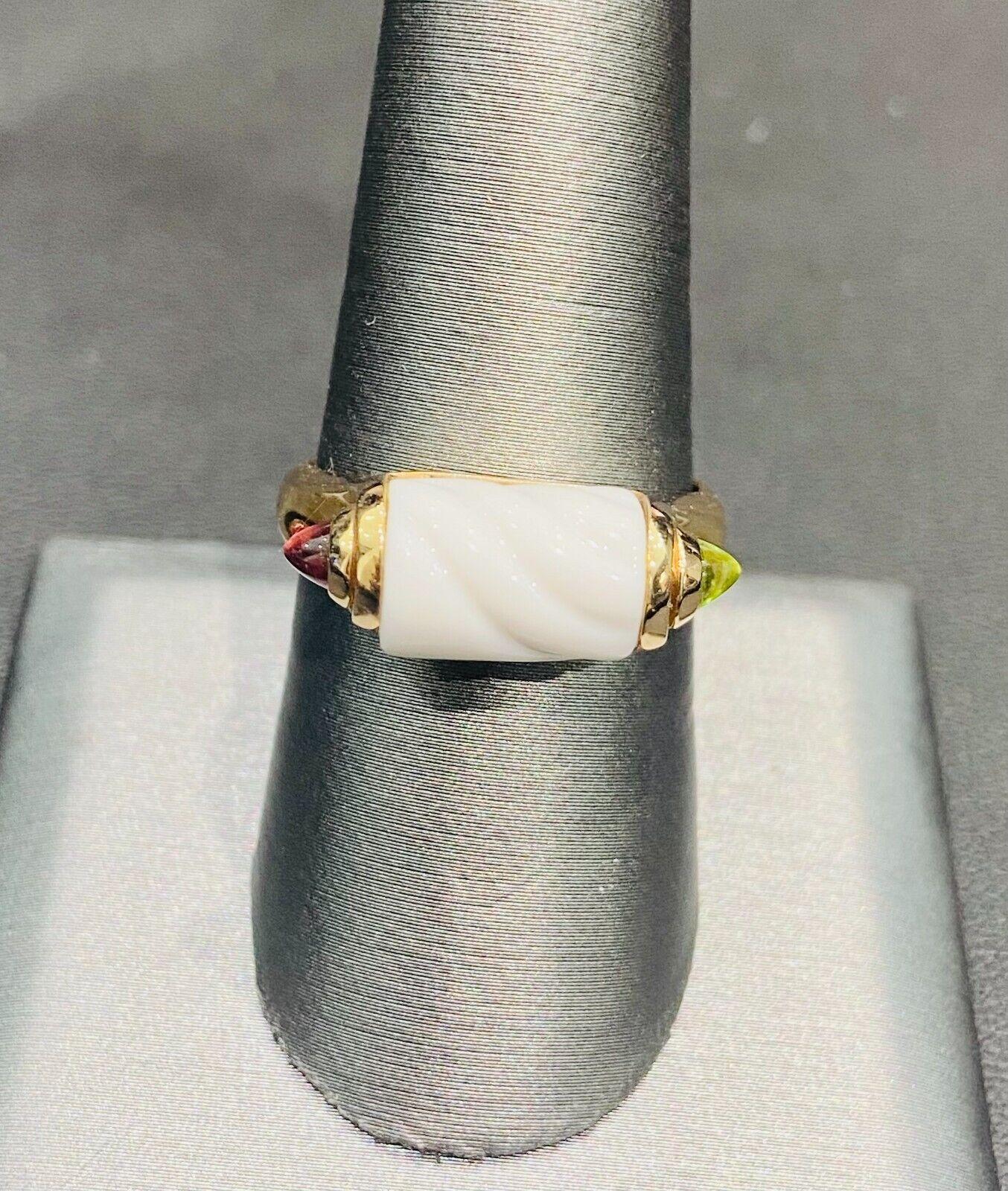 Bvlgari Italy Chandra Collection 18k Yellow Gold, Ceramic, Tourmaline & Peridot Ring Circa 1980s Vintage

Here is your chance to purchase a beautiful and highly collectible designer ring.  
BVLGARI Tronchetto Ring 

White Ceramic Chandra with 18k