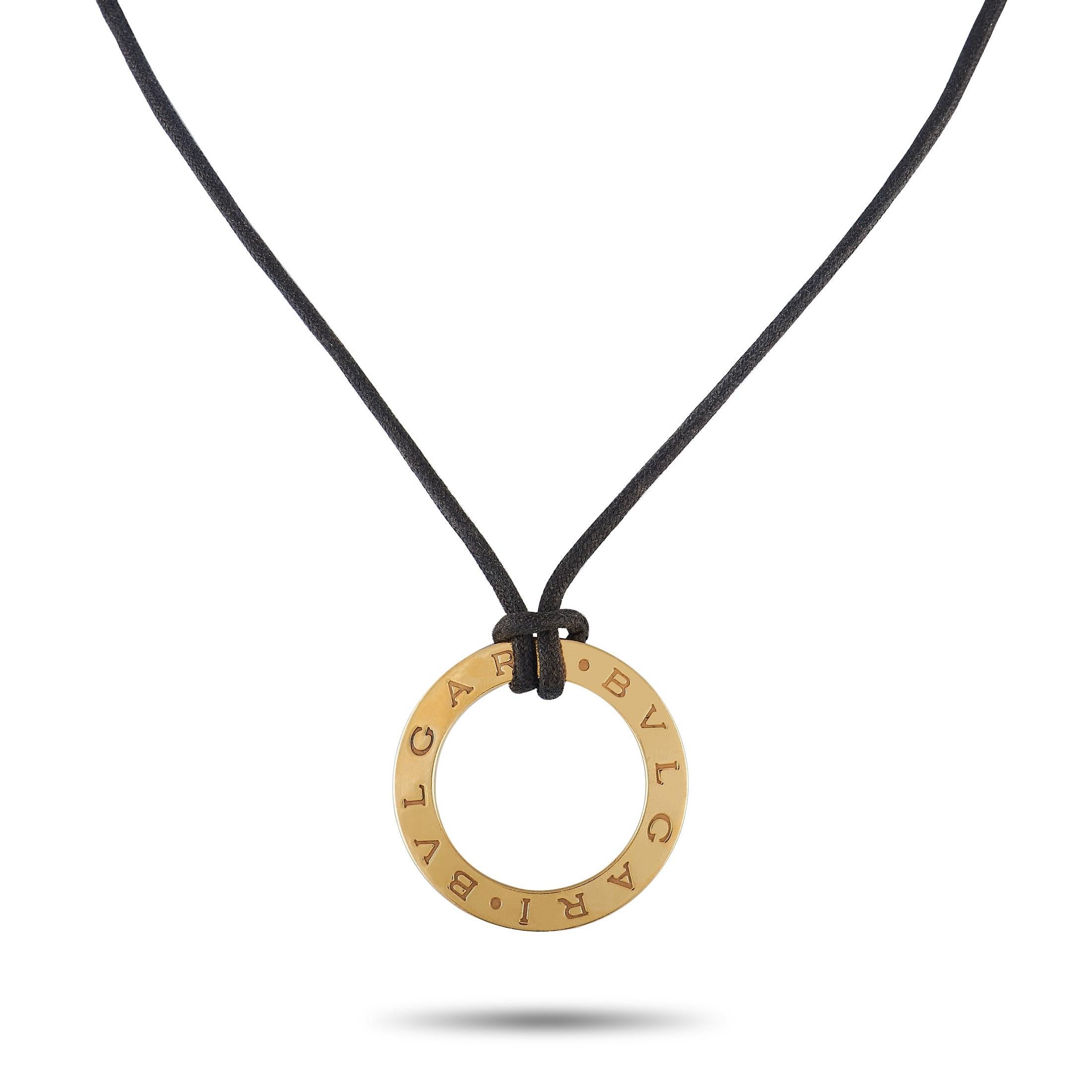This dynamic Bvlgari necklace pairs lustrous 18K Yellow Gold with a minimalist cord – the result is a piece of jewelry with a surprising sense of style. A circular pendant measuring 1.45” round proudly displays the luxury brand’s moniker. The 24”