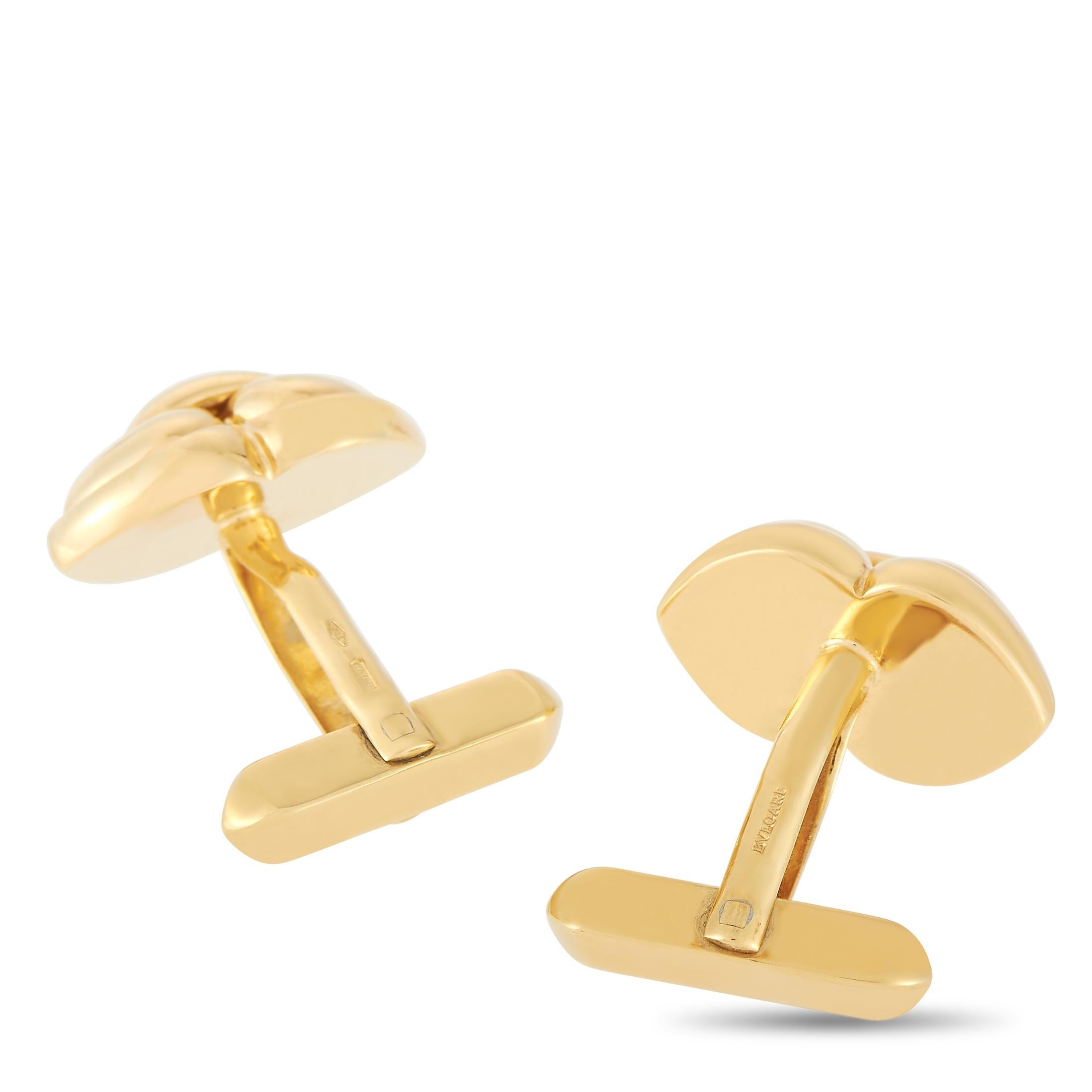 Crafted from 18K Yellow Gold, these Bvlgari cufflinks exude the luxury brand’s commitment to classic design. The iconic shape is sleek, dignified, and extraordinarily elegant. Measuring 0.5” by 0.75”, these will add a subtle touch of refinement to