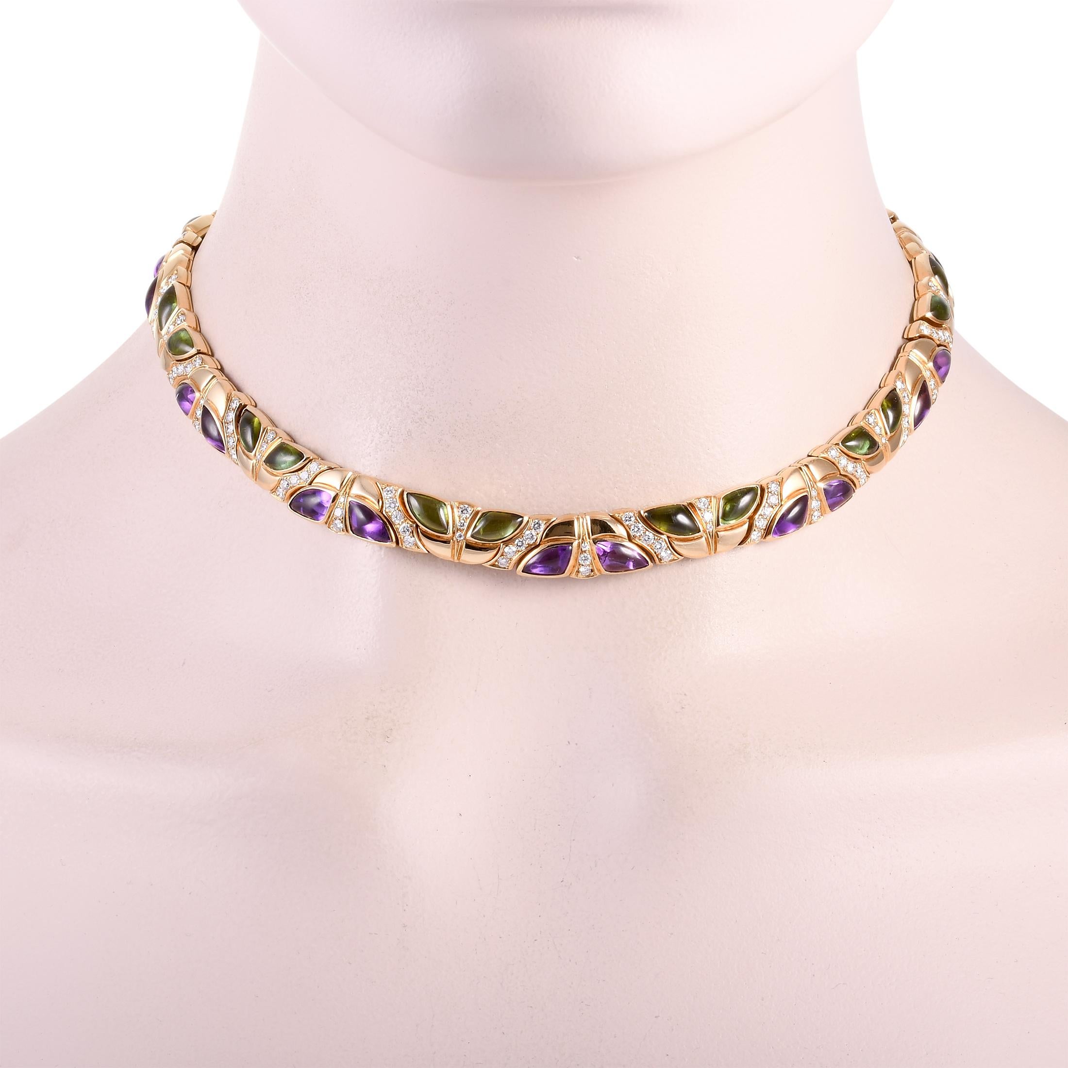 This Bvlgari necklace is crafted from 18K yellow gold and weighs 93.5 grams, measuring 15.70” in length. The necklace is embellished with amethysts, peridots, and a total of approximately 3.20 carats of diamonds that boast F color and VVS